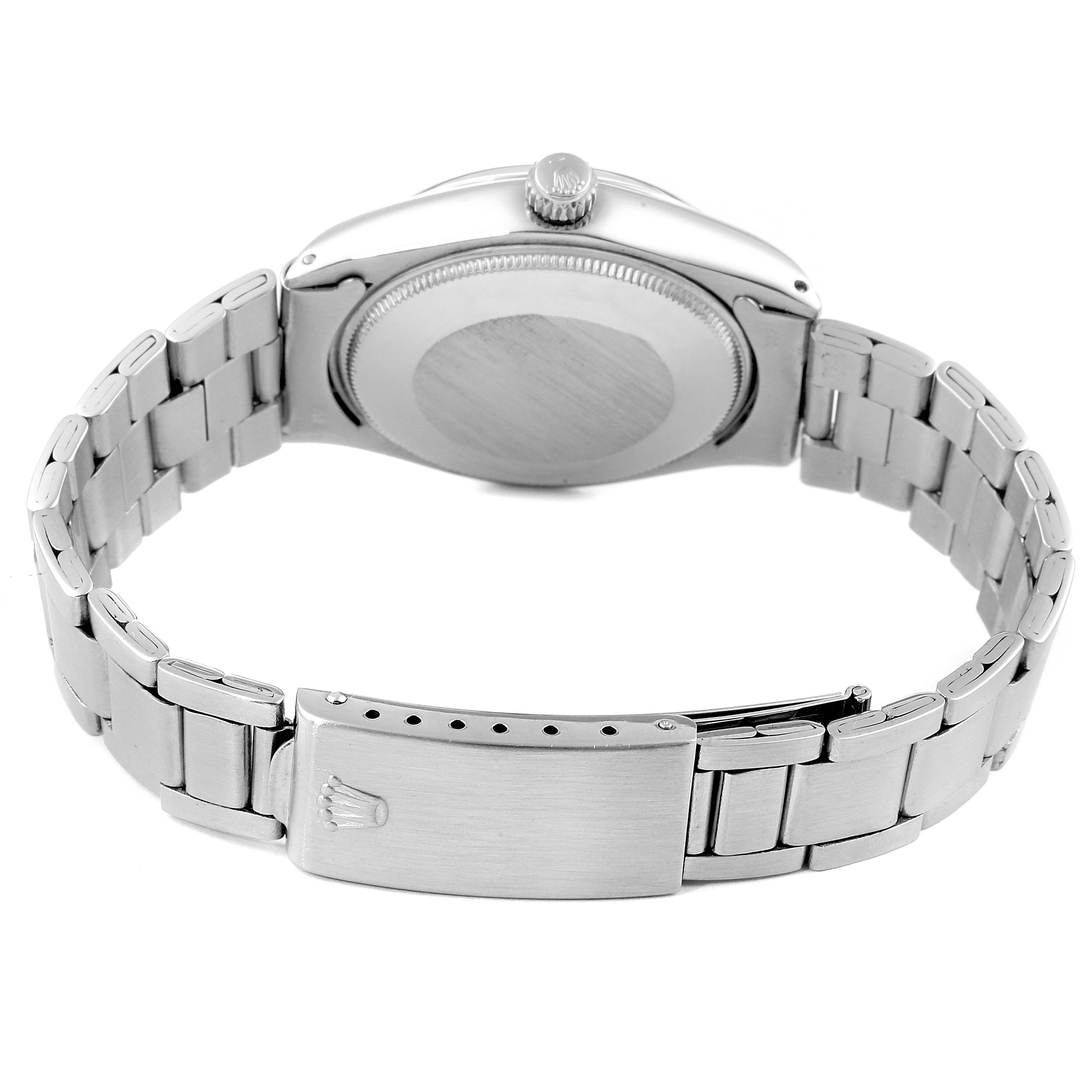 The image shows the back view of a Rolex Vintage Collection 5500 Men's Stainless Steel Silver Dial 5500 Men's Stainless Steel Silver Dial watch, highlighting its clasp and bracelet.