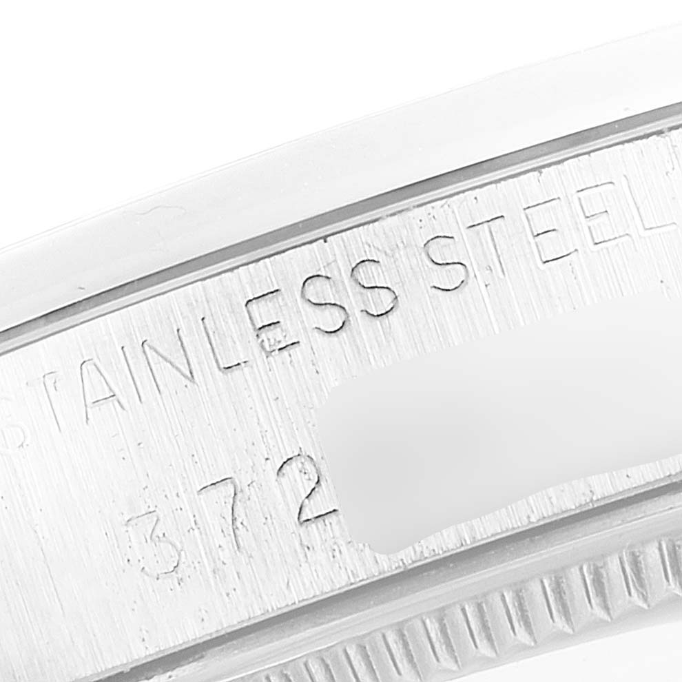 The image shows a close-up of the stainless steel casing of a Rolex Vintage Collection 5500 Men's Stainless Steel Silver Dial 5500 Men's Stainless Steel Silver Dial watch.