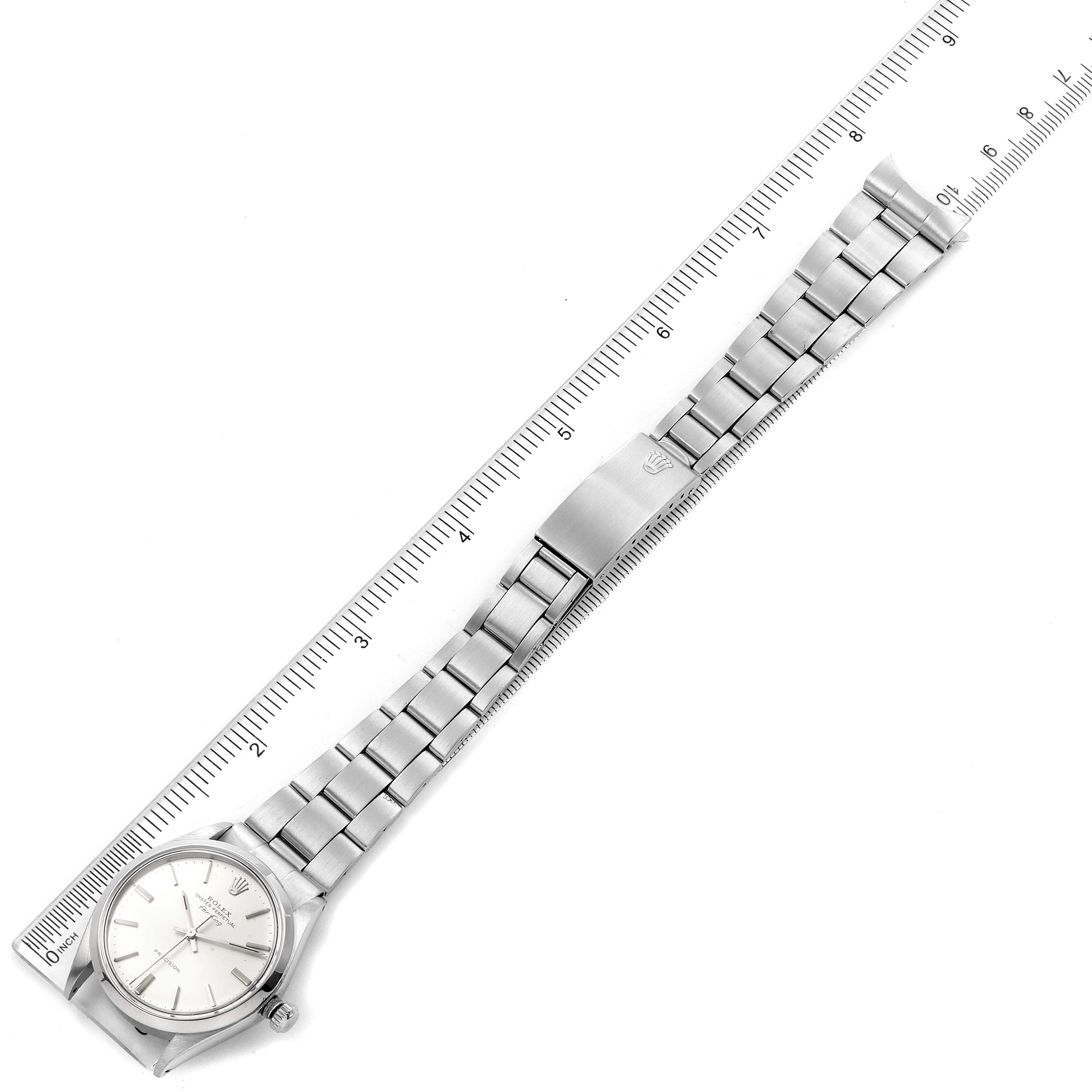 The image shows a Rolex Vintage Collection 5500 Men's Stainless Steel Silver Dial 5500 Men's Stainless Steel Silver Dial watch laid flat with a ruler measuring its length.