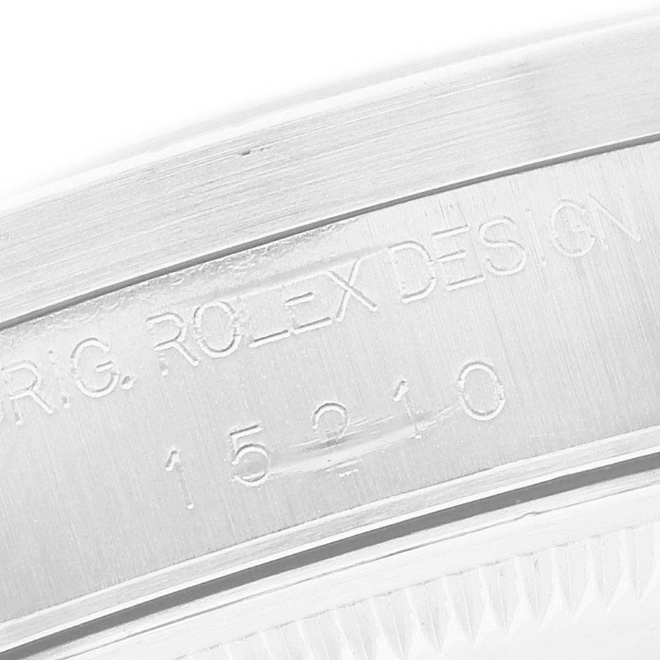 The image shows the engraved side of the case of a Rolex Date 15210 Men's Stainless Steel Black Dial model, highlighting the model number.