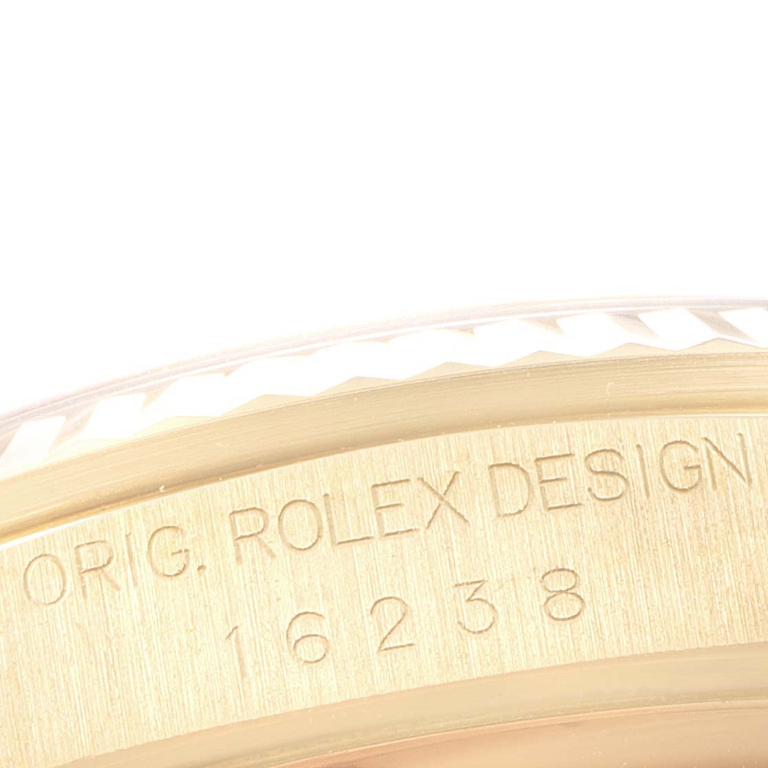 This image shows a close-up of the case side engraving on a Rolex President 16238 Men's Yellow Gold Champagne Dial 16238 Men's Yellow Gold Champagne Dial model watch.
