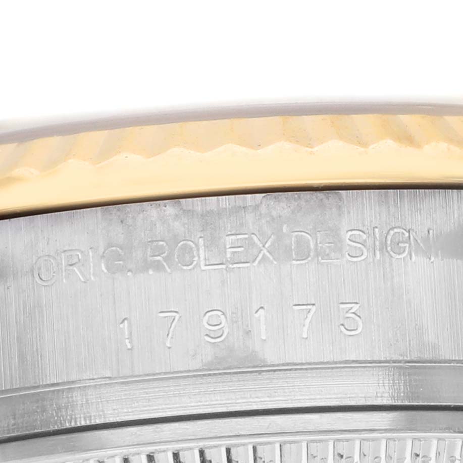 The image shows the side engraving on the case of a Rolex Datejust 179173 Women's Steel and Gold (two tone) Black Dial, highlighting the model number.