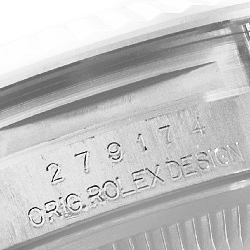 The image shows a close-up of the case engraving on a Rolex Datejust 279174 Women
s Stainless Steel Mother of Pearl Dial 279174 Women
s Stainless Steel Mother of Pearl Dial watch.