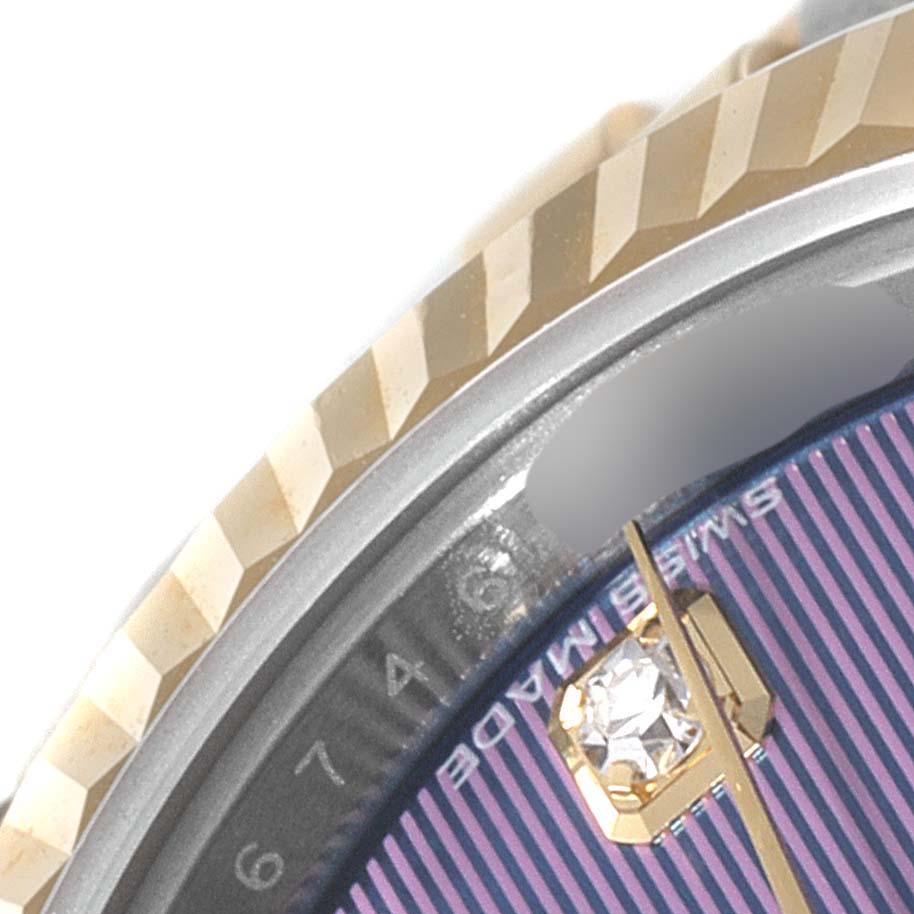 The image shows a close-up angle of the dial and fluted bezel of a Rolex Datejust 279173 Women's Stainless Steel Purple Dial 279173 Women's Stainless Steel Purple Dial watch.