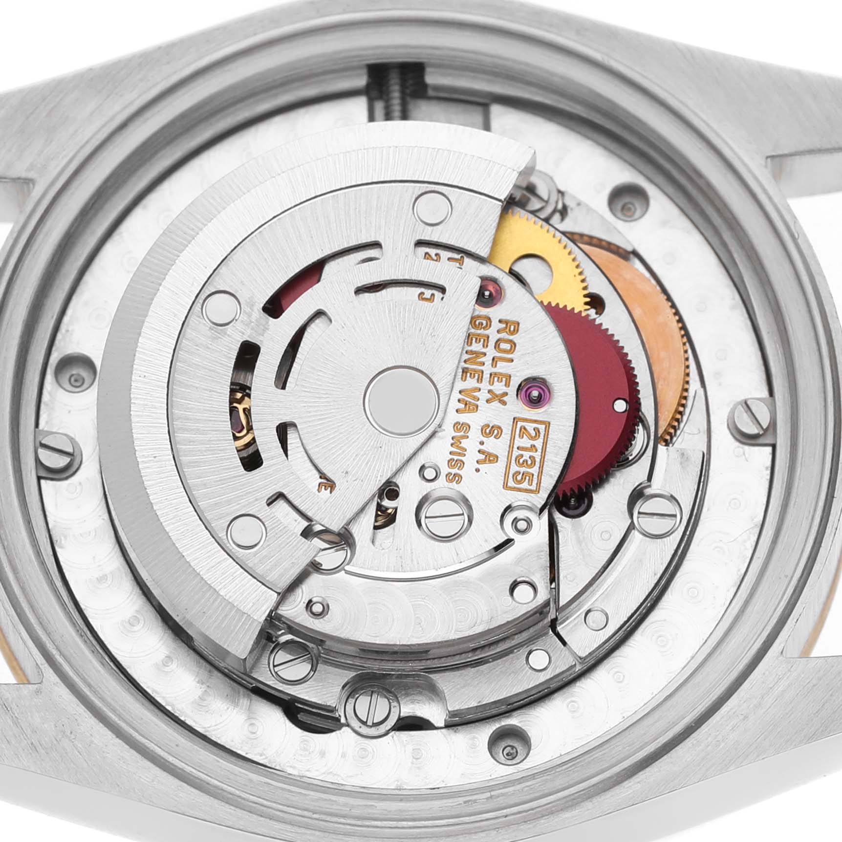 The image shows the movement of the Rolex Datejust 68273 Women's Steel and Gold (two tone) White Dial watch from the back, highlighting its intricate mechanical components.