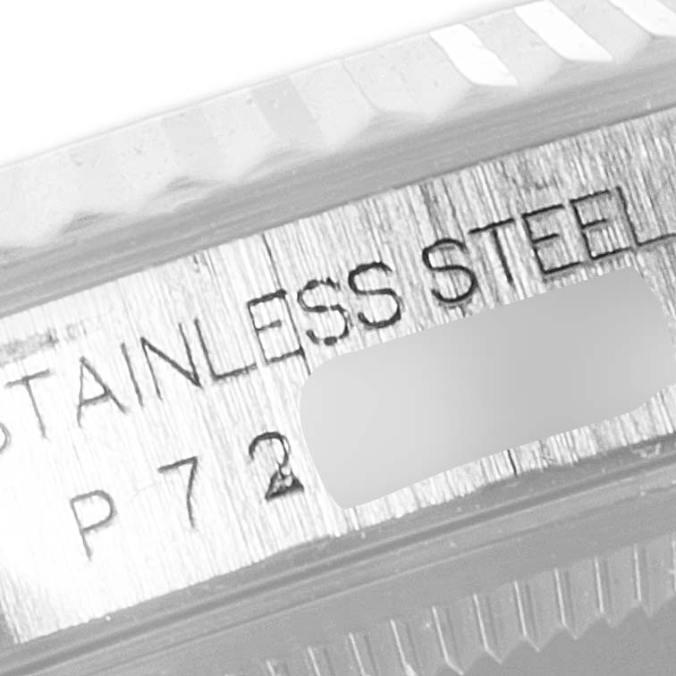 The image shows a close-up view of the lettering on a stainless steel casing of a Rolex Datejust 16234 Men
s Stainless Steel Black Dial 16234 Men
s Stainless Steel Black Dial watch.