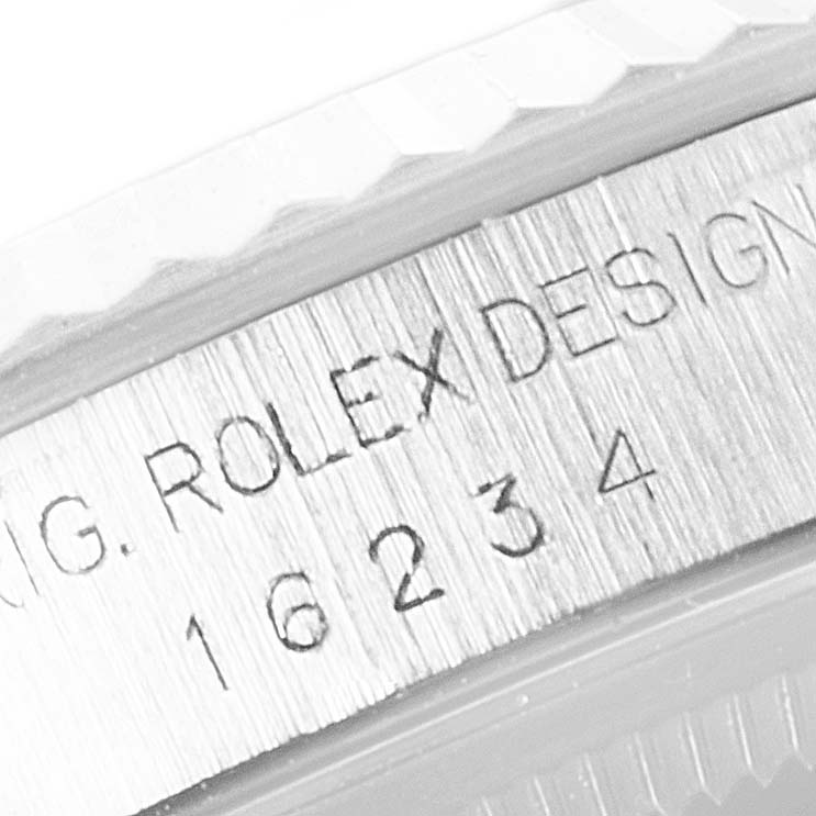 The image shows a close-up angle of the Rolex brand engraving on the case of a Datejust model, including the reference number 16234.