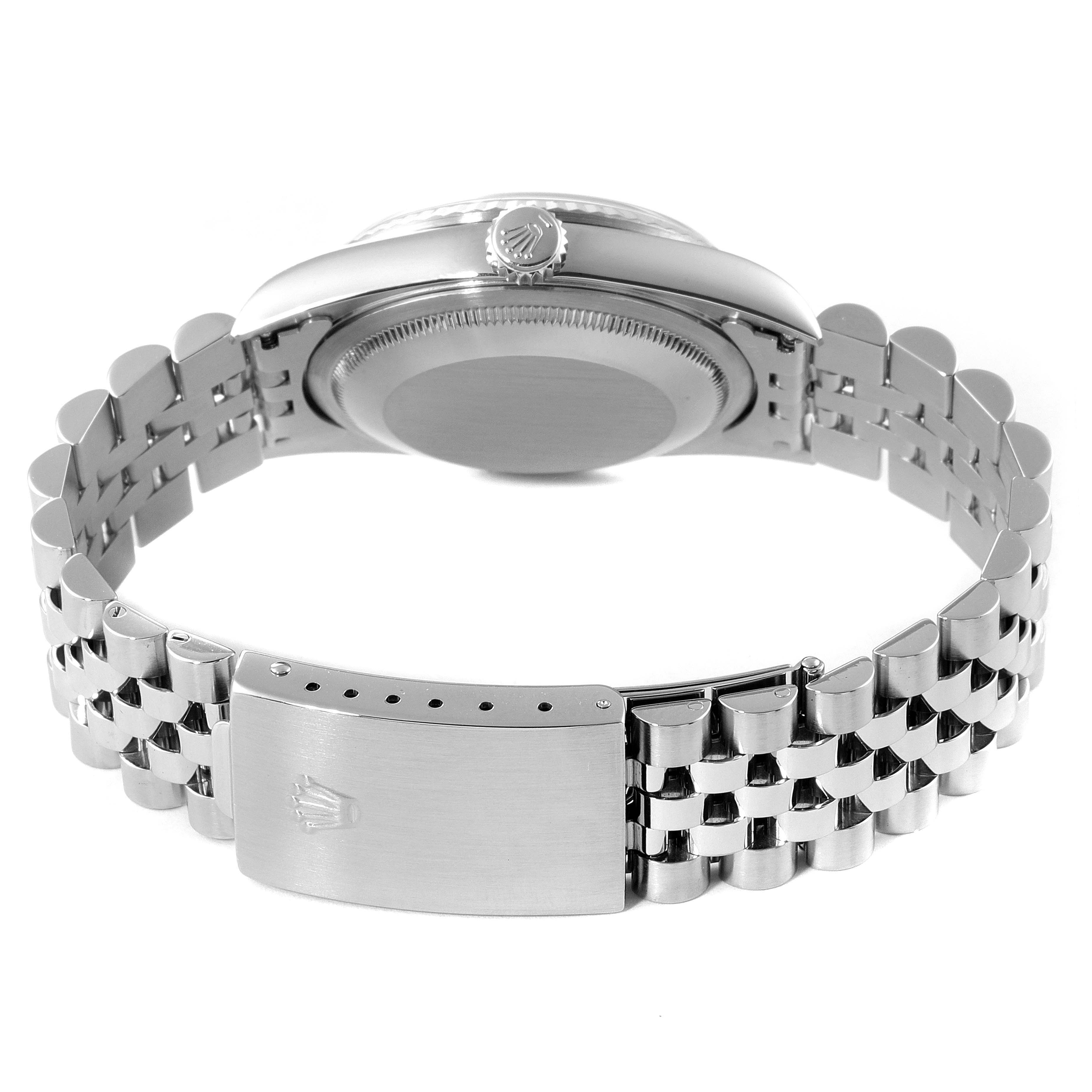 The image shows the back view of a Rolex Datejust 16234 Men
s Stainless Steel Black Dial 16234 Men
s Stainless Steel Black Dial watch, highlighting its case, crown, and Jubilee bracelet with a clasp.