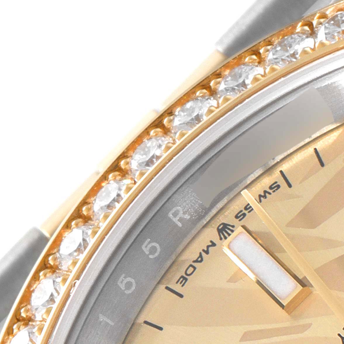 The image shows a close-up of the Rolex Datejust 126283 Men's Steel and Gold (two tone) Champagne Dial 126283 Men's Steel and Gold (two tone) Champagne Dial watch, focusing on the diamond-studded bezel and partial dial.