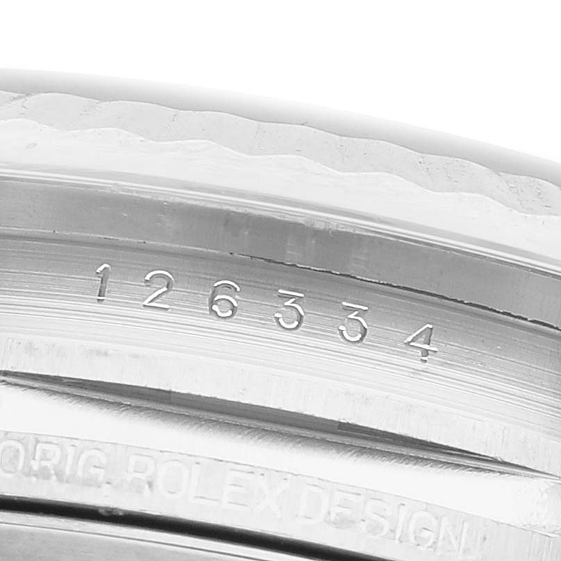 The image shows a close-up angle of the bezel and inner rim with engraved numbers of a Rolex Datejust 41 126334 Men's Stainless Steel Blue Dial.