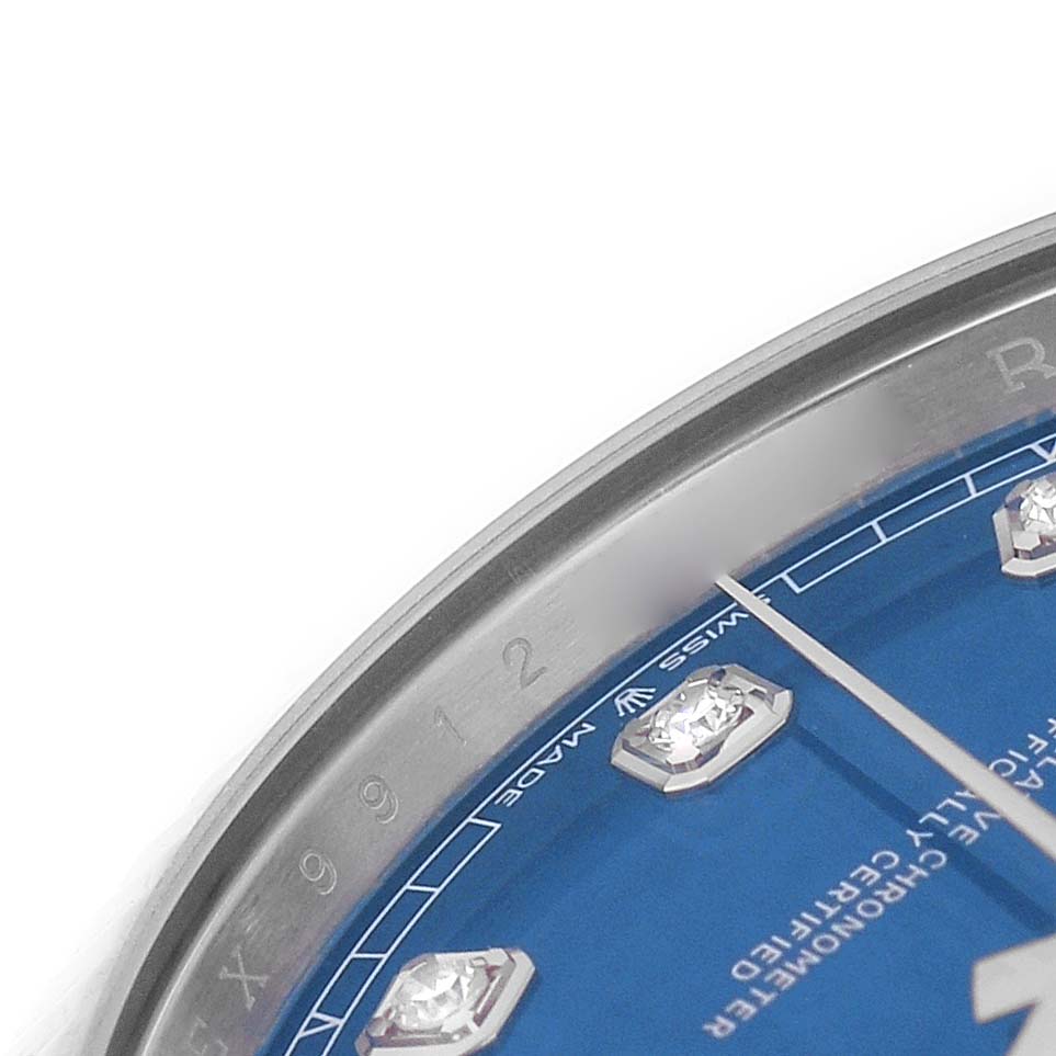This image shows a close-up of the Rolex Datejust 41 126334 Men's Stainless Steel Blue Dial, focusing on the blue dial, diamond hour markers, and bezel edge.