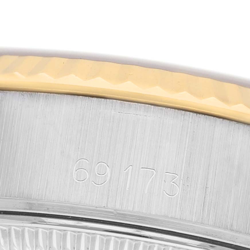The image shows a close-up of the case side and bezel of a Rolex Datejust 69173 Women's Steel and Gold (two tone) Champagne Dial, highlighting the engraved model number.