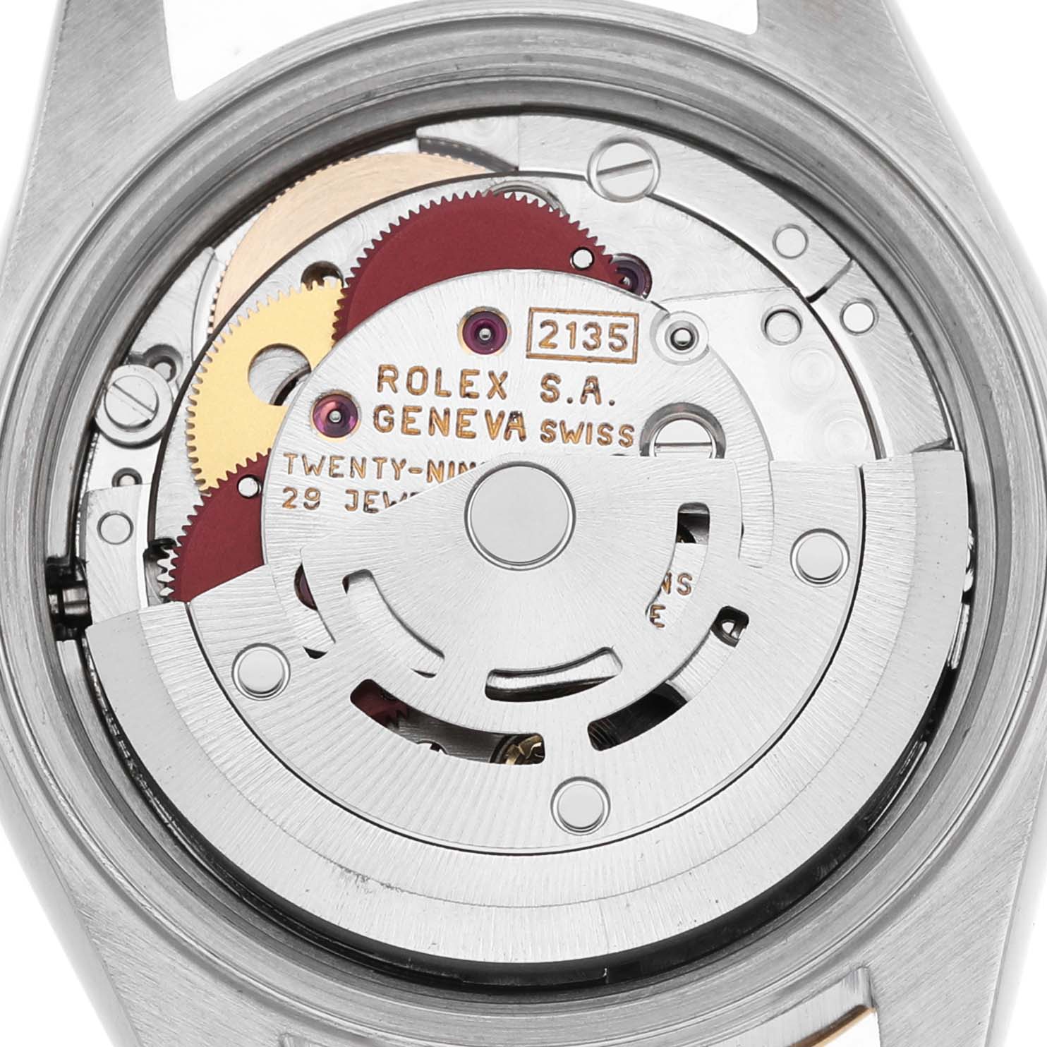 The image shows the movement of a Rolex Datejust 69173 Women's Steel and Gold (two tone) Champagne Dial watch, highlighting gears and the rotor.