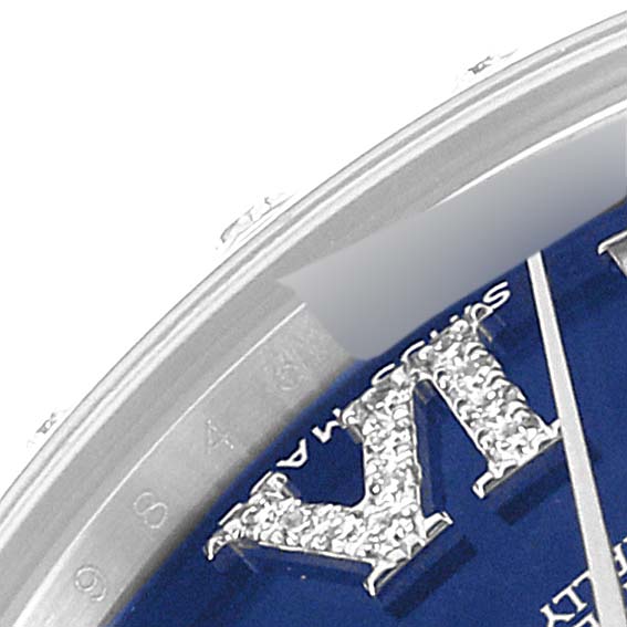 This close-up angle showcases part of the dial of a Mid-Size Rolex watch, highlighting the diamonds and the edge of the bezel.