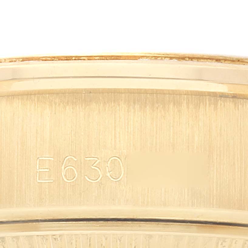 This image shows a close-up of the inside band of a Rolex President 69128 Women
s Yellow Gold Champagne Dial 69128 Women
s Yellow Gold Champagne Dial model watch, displaying its engraved model number.