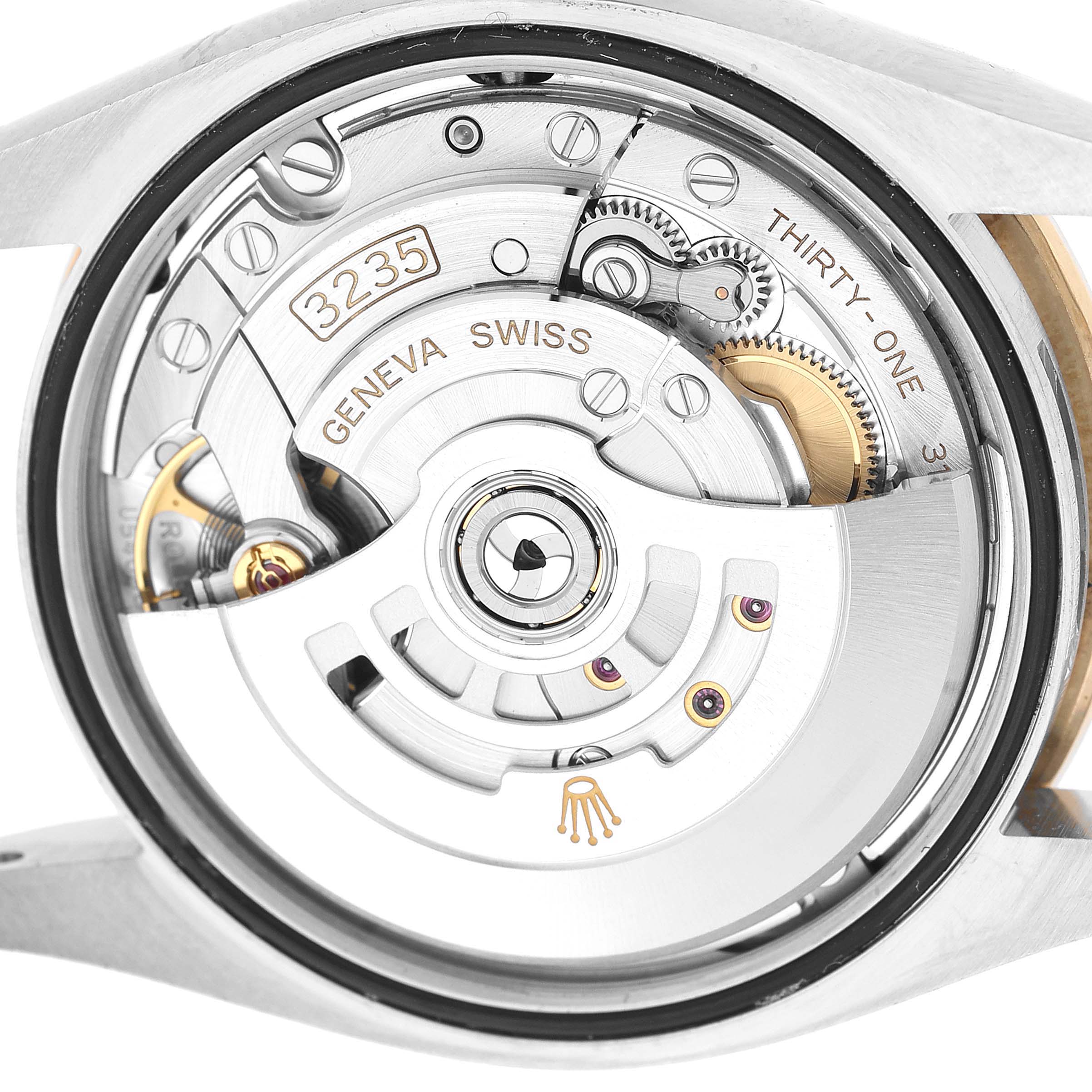 The image shows a close-up view of the movement mechanism of a Rolex Datejust 126283RBR Men's Steel and Gold (two tone) Silver Dial watch, highlighting the rotor and gears.