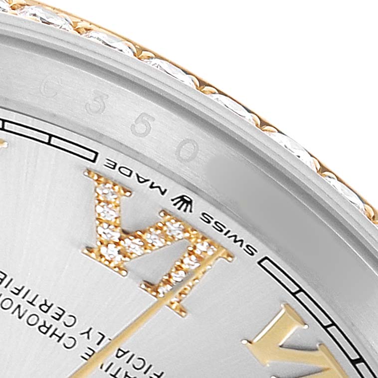 The image shows a close-up of a Rolex Datejust 126283RBR Men's Steel and Gold (two tone) Silver Dial watch, highlighting the edge of the dial, bezel, and diamond-set Roman numeral.