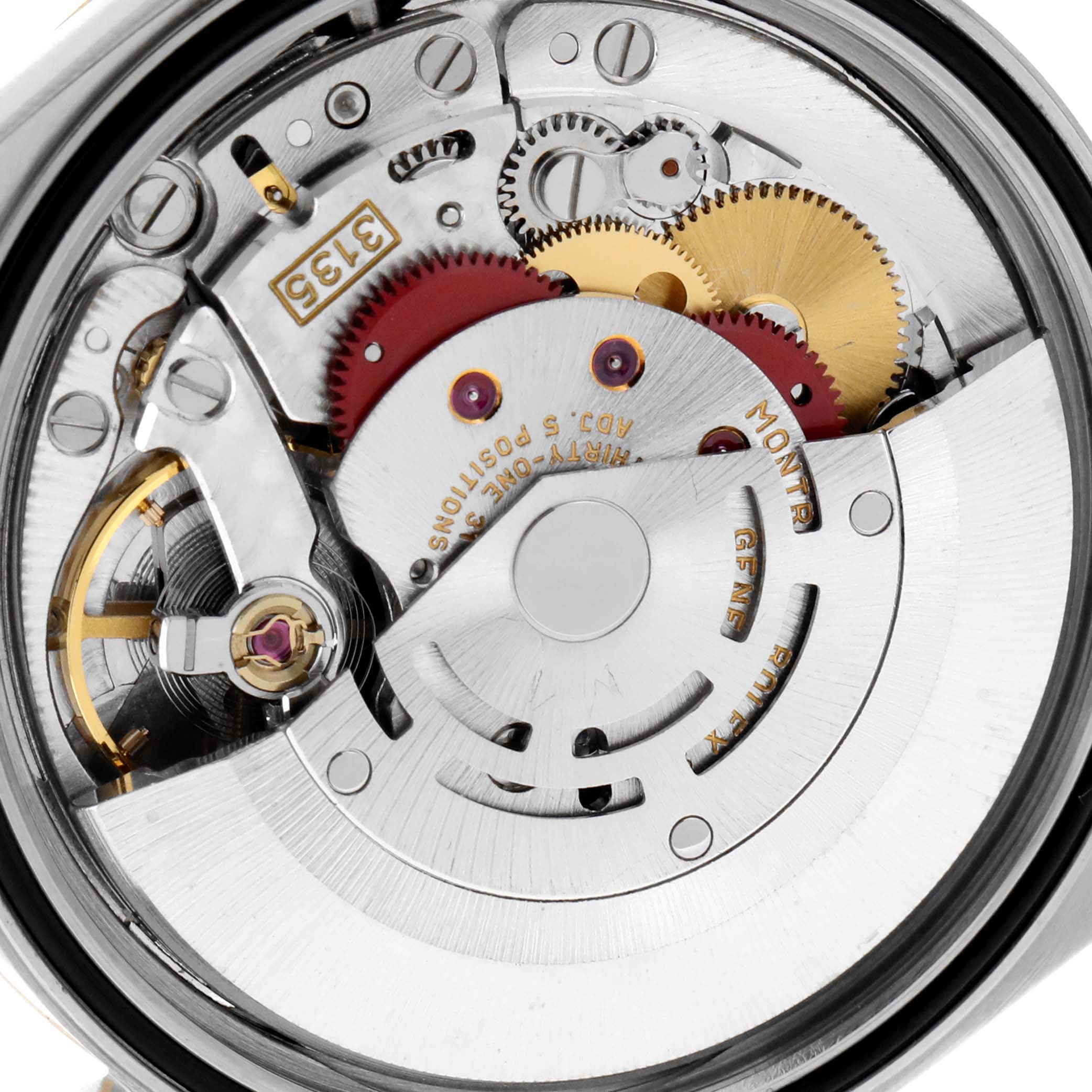 This image shows a close-up view of the movement inside a Rolex Datejust 16233 Men's Steel and Gold (two tone) Champagne Dial 16233 Men's Steel and Gold (two tone) Champagne Dial watch, highlighting its intricate gears and mechanisms.