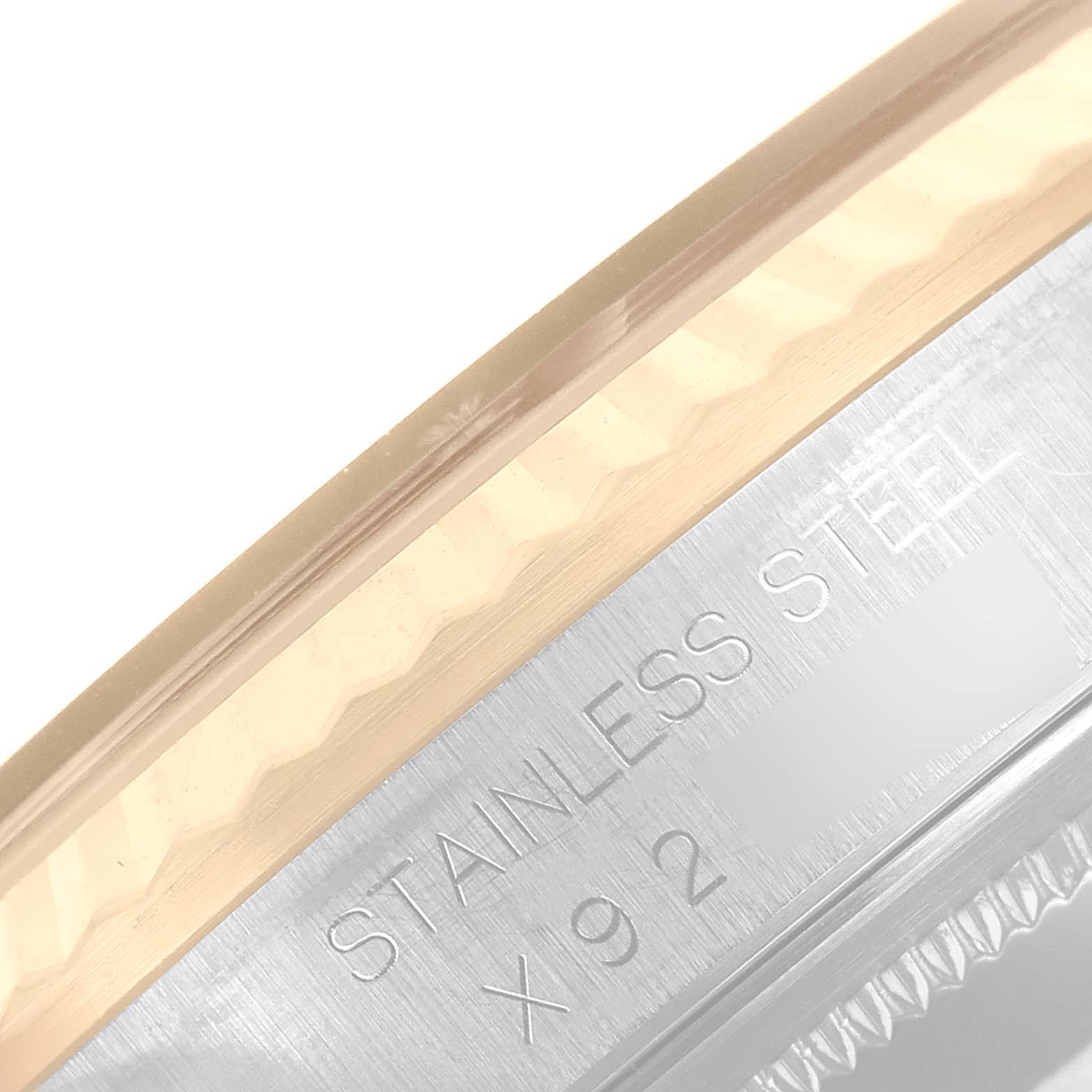 This image shows a close-up of the bezel and case side of a Rolex Datejust 16233 Men's Steel and Gold (two tone) Champagne Dial 16233 Men's Steel and Gold (two tone) Champagne Dial watch, highlighting the stainless steel material.