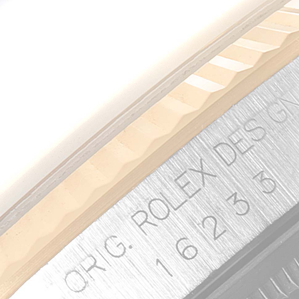 This image shows a close-up of the bezel and engraved text on the case of a Rolex Datejust 16233 Men
s Steel and Gold (two tone) Grey Dial 16233 Men
s Steel and Gold (two tone) Grey Dial watch.