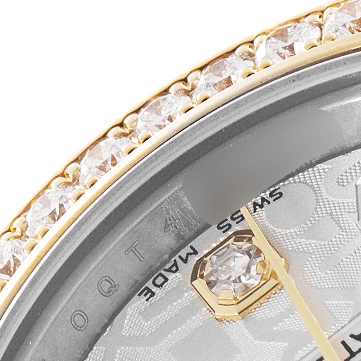 This close-up image shows the bezel and part of the dial of a Rolex Datejust 179383 Women
s Steel and Gold (two tone) Silver Dial 179383 Women
s Steel and Gold (two tone) Silver Dial watch, highlighting the diamonds and "SWISS MADE" text.
