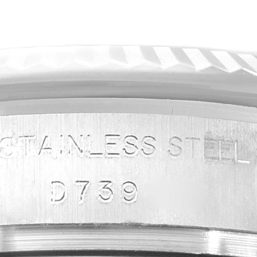 This image shows a close-up of the side of the Rolex Datejust 179174 Women's Stainless Steel White Dial 179174 Women's Stainless Steel White Dial watch case, highlighting the "STAINLESS STEEL" engraving and part of the serial number "D739."