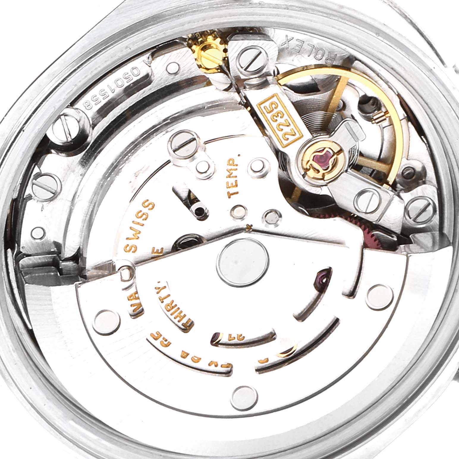 This image shows an internal view of the Rolex Datejust 79174 Women's Stainless Steel Pink Dial 79174 Women's Stainless Steel Pink Dial watch movement mechanism at a close-up angle.