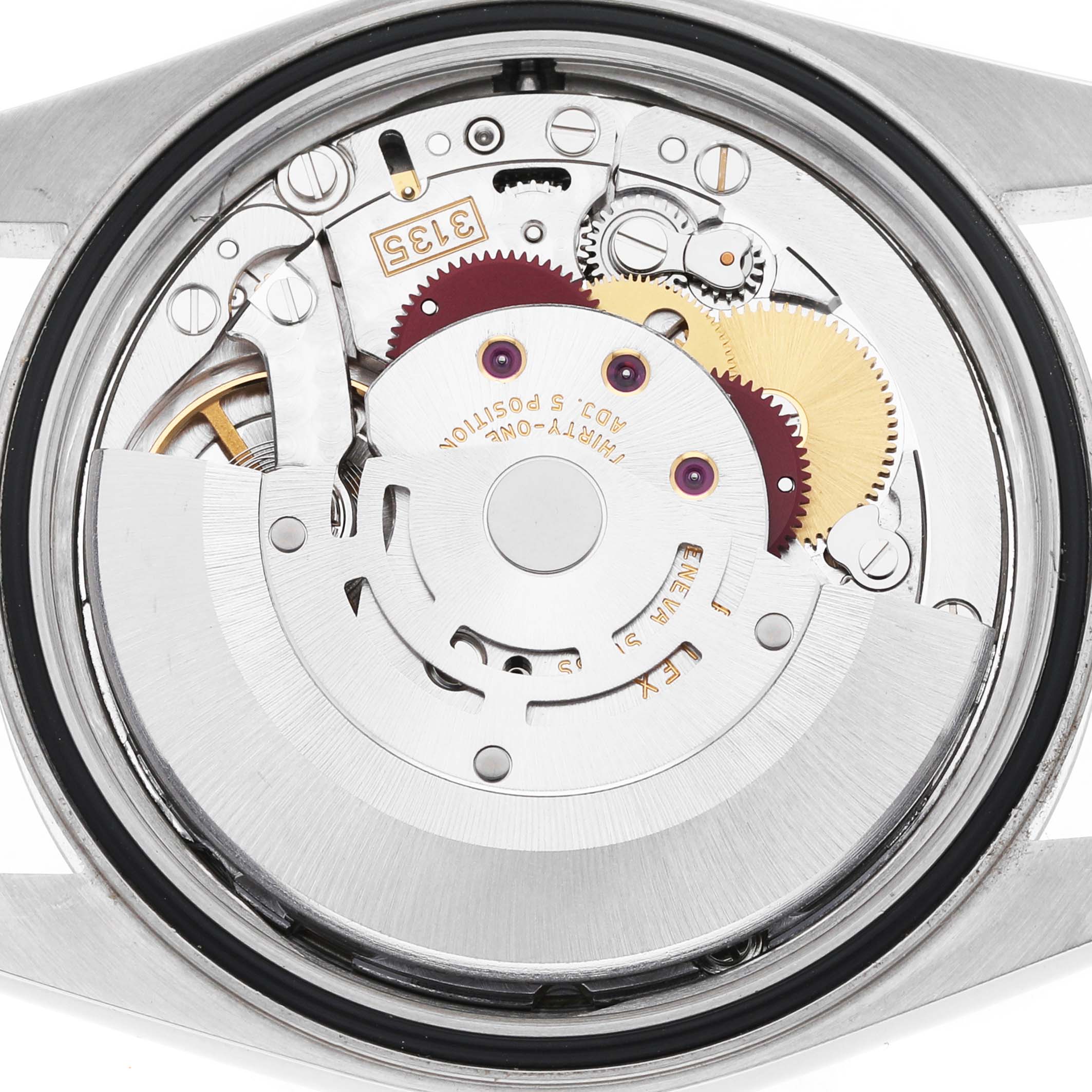 The image shows the movement of a Rolex Datejust 16234 Men's Stainless Steel Silver Dial watch from the back, highlighting gears and components.