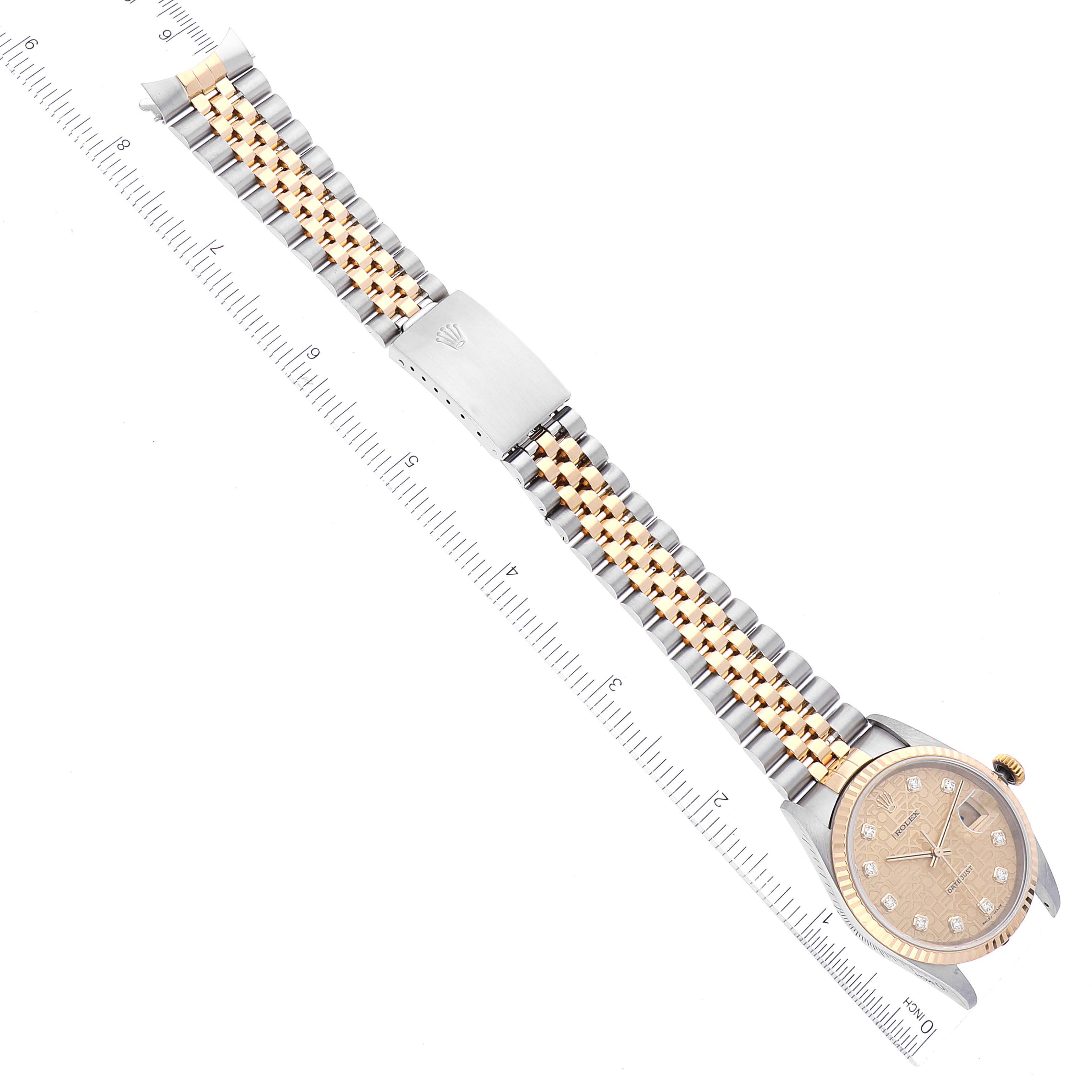 The image shows a Rolex Datejust 16233 Men's Steel and Gold (two tone) Champagne Dial 16233 Men's Steel and Gold (two tone) Champagne Dial watch laid flat, showcasing its bracelet, clasp, and dial from a top-down angle with a ruler beside it.