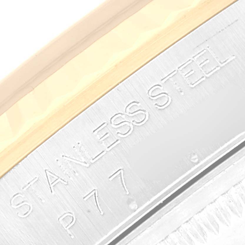 This close-up image shows the engraving on the stainless steel part of the Rolex Datejust 16233 Men's Steel and Gold (two tone) Champagne Dial 16233 Men's Steel and Gold (two tone) Champagne Dial bezel.