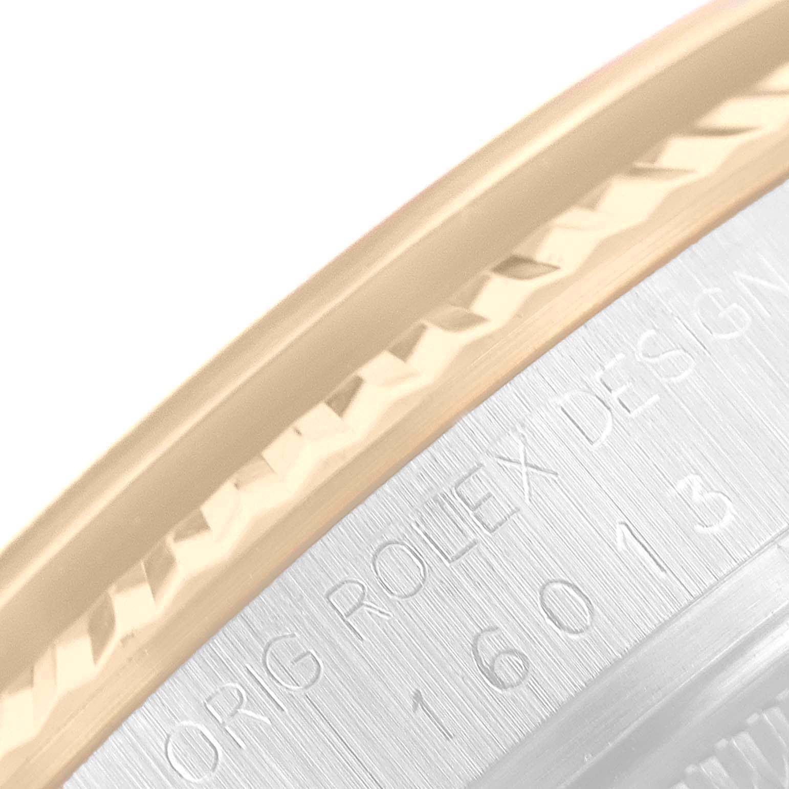 The image shows a close-up of the Rolex Vintage Collection 16013 Men's Steel and Gold (two tone) Champagne Dial 16013 Men's Steel and Gold (two tone) Champagne Dial model's bezel and part of the engraved case back.