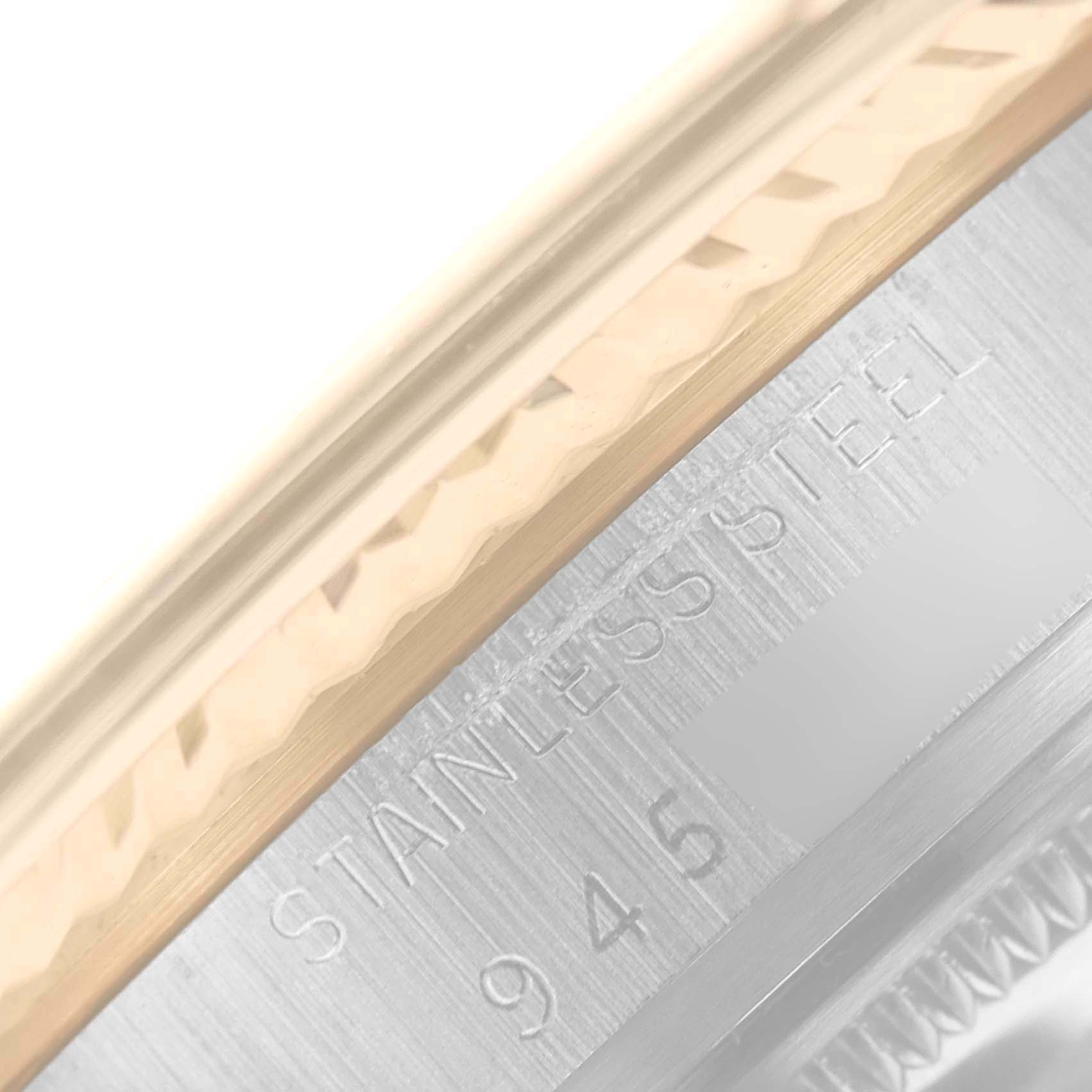 The image shows a close-up angle of the Stainless Steel engraved inner bezel of a Rolex Vintage Collection 16013 Men's Steel and Gold (two tone) Champagne Dial 16013 Men's Steel and Gold (two tone) Champagne Dial watch.