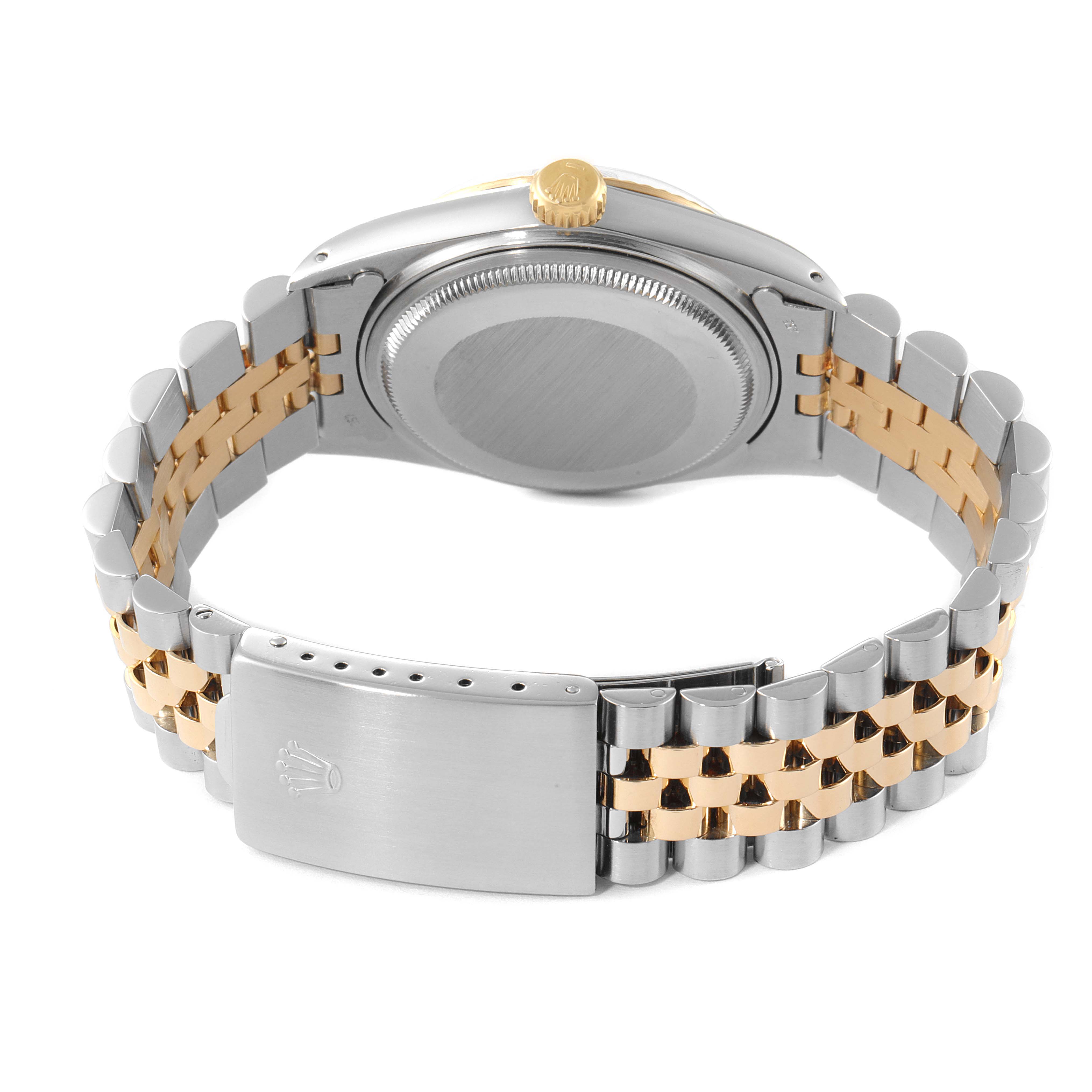 The image shows the back view of a Vintage Collection Rolex watch, highlighting its two-tone metal bracelet and clasp.