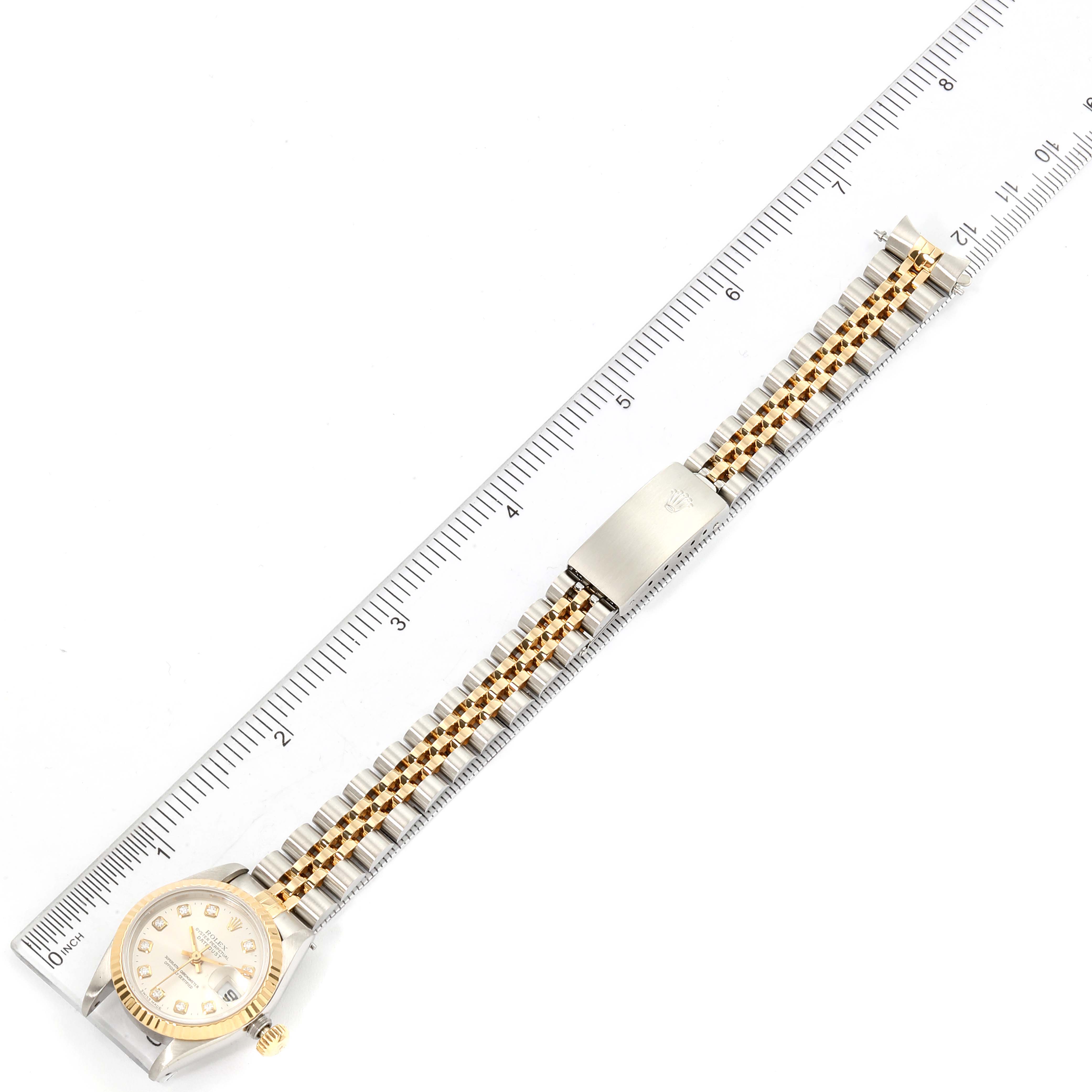 The image shows a Rolex Datejust 69173 Men's Steel and Gold (two tone) Silver Dial 69173 Men's Steel and Gold (two tone) Silver Dial watch from a top-down angle, displaying its face, bezel, bracelet, and clasp.