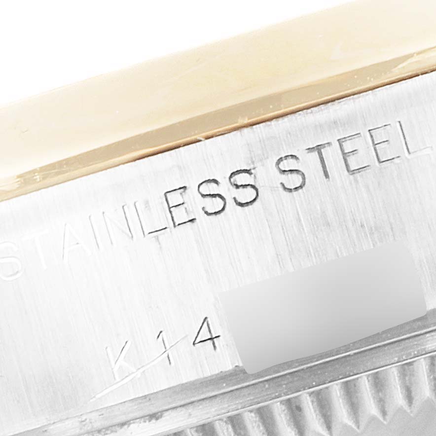 The image shows a close-up of the stainless steel and gold bezel on a Rolex Datejust 79163 Women's Steel and Gold (two tone) Grey Dial 79163 Women's Steel and Gold (two tone) Grey Dial watch.