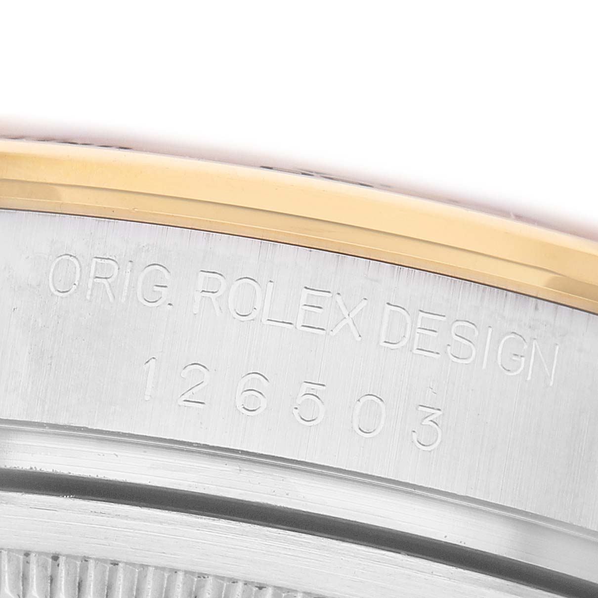 The image shows a close-up of the side engraving on a Rolex Daytona 126503 Men's Steel and Gold (two tone) Champagne Dial, displaying the "ORIG. ROLEX DESIGN" and model number.