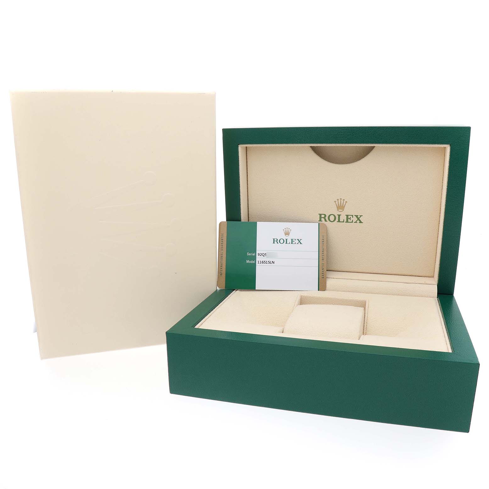 The image shows a green Rolex box for the Daytona model, alongside paperwork and an outer box.