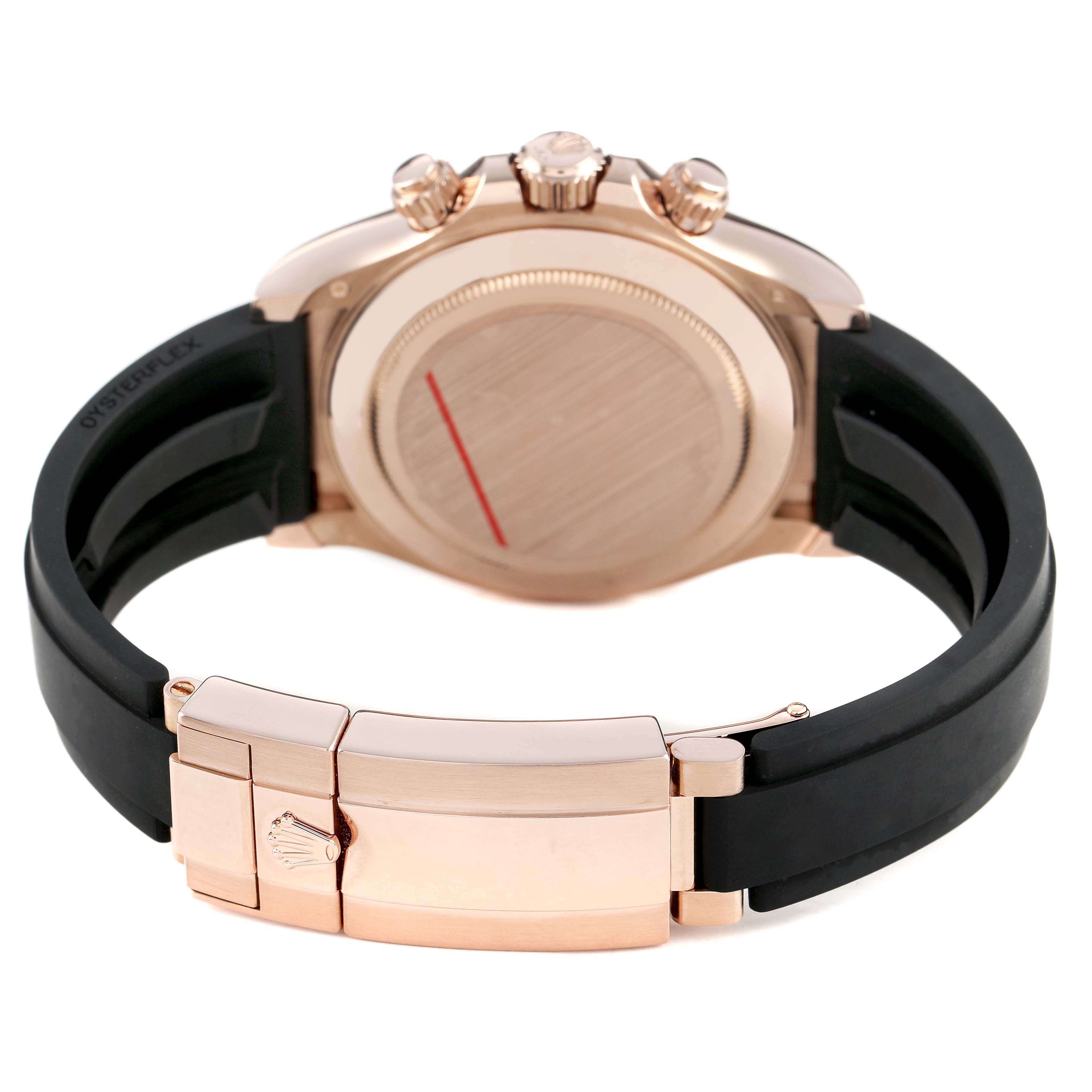 The image shows the back view of a Rolex Daytona 116515LN Men's Rose Gold Brown Dial, highlighting the clasp, case back, and crown.