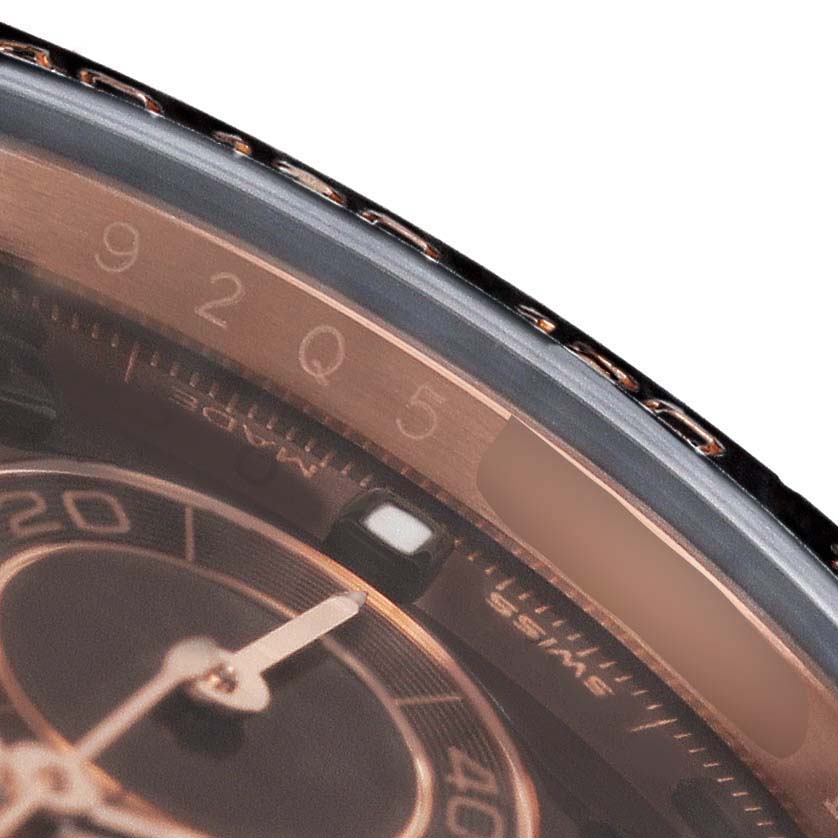 The image shows a close-up of the Rolex Daytona 116515LN Mens Rose Gold Brown Dials dial and bezel, focusing on the minute markers and hand.