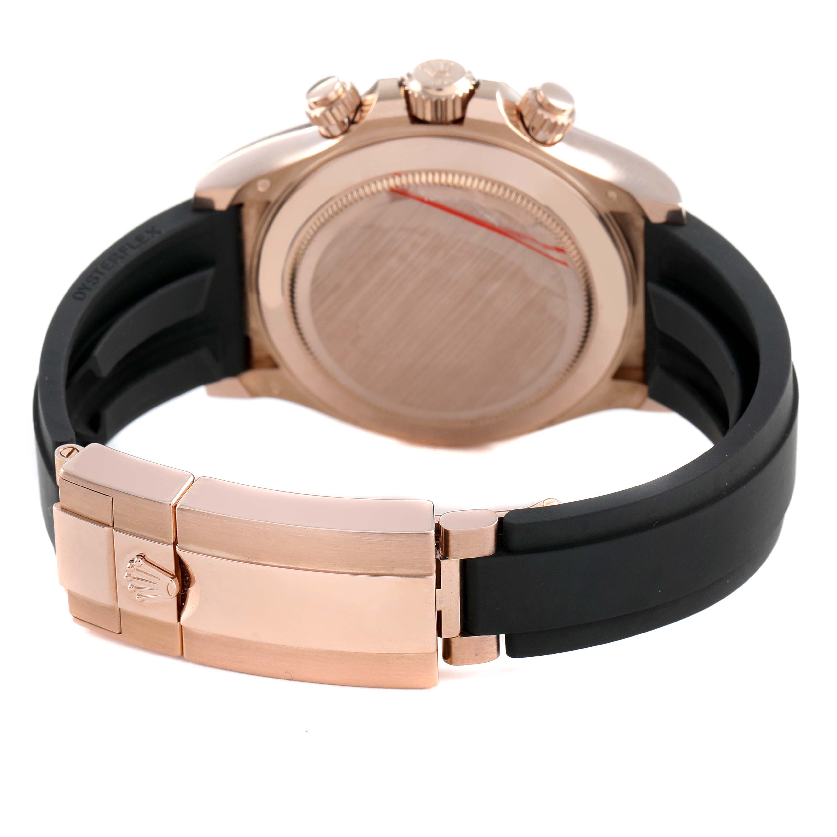 The image shows the back and clasp of the Rolex Daytona 116515LN Men's Rose Gold Brown Dial watch at an angle, highlighting the bracelet and crown.