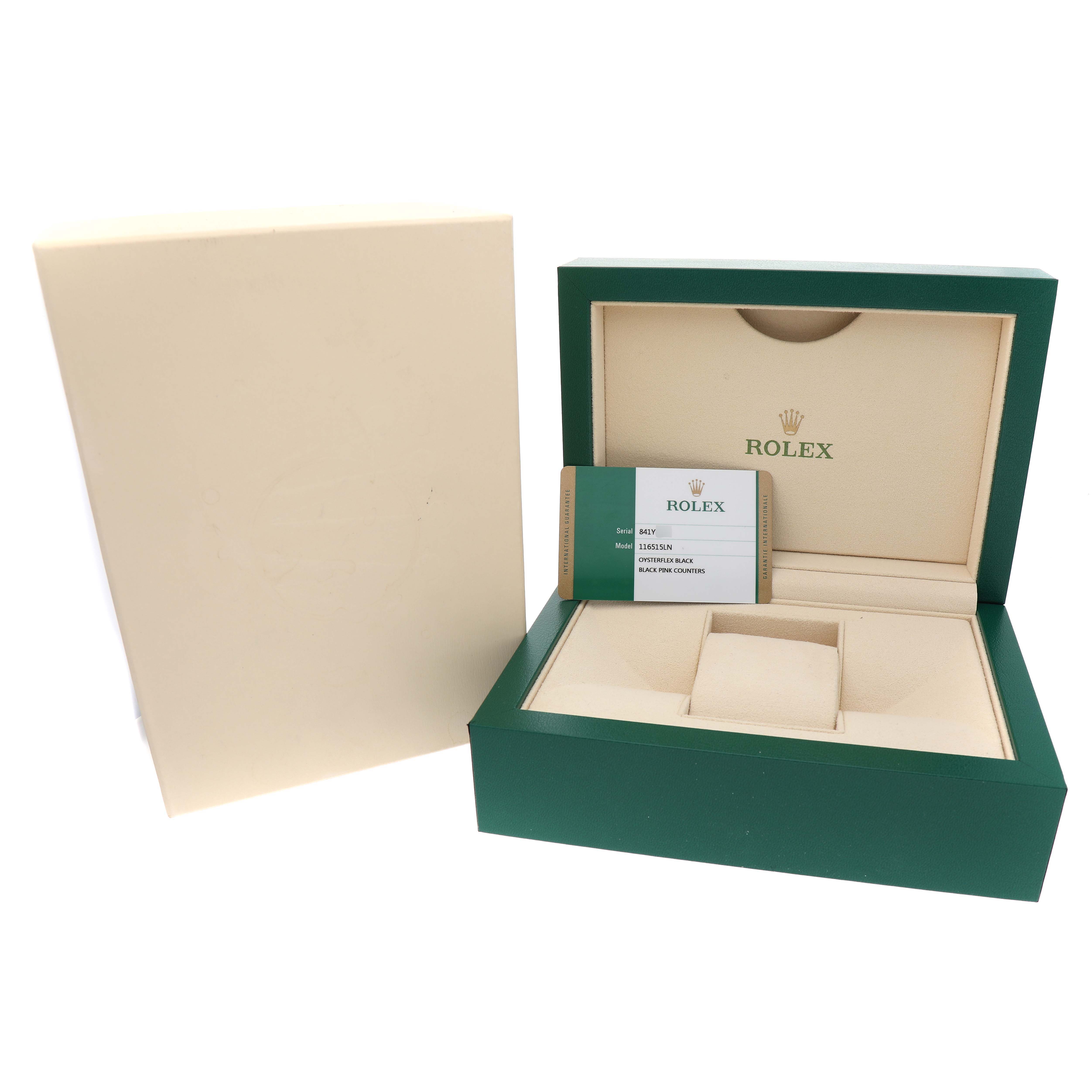 The image shows a Rolex Daytona 116515LN Men's Rose Gold Brown Dial packaging box and certificate at an angle, highlighting the brand logo and interior compartments.