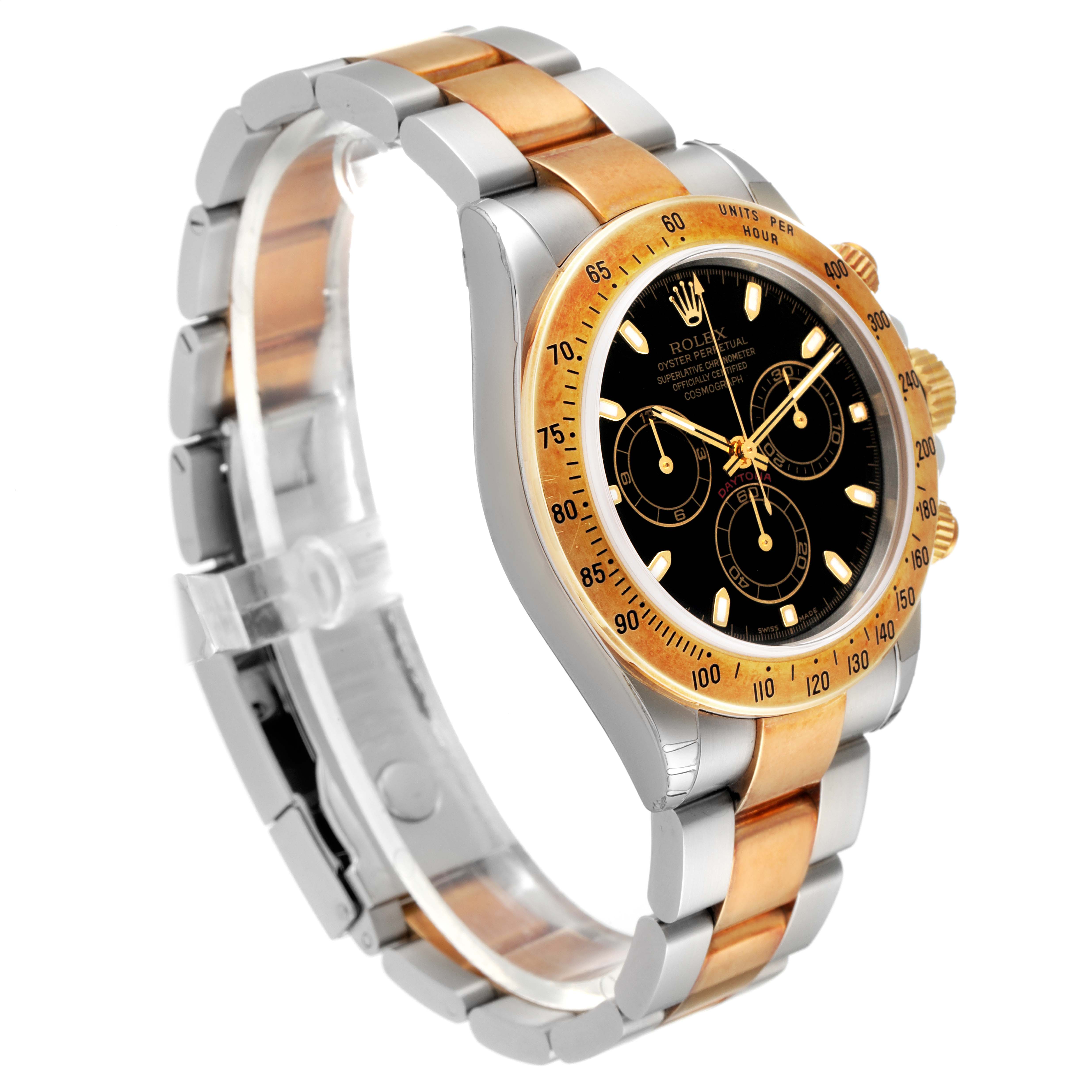 The image shows a Rolex Daytona 116523 Men
s Steel and Gold (two tone) Black Dial 116523 Men
s Steel and Gold (two tone) Black Dial watch at a slight side angle, highlighting its two-tone metal strap, black dial, and bezel.
