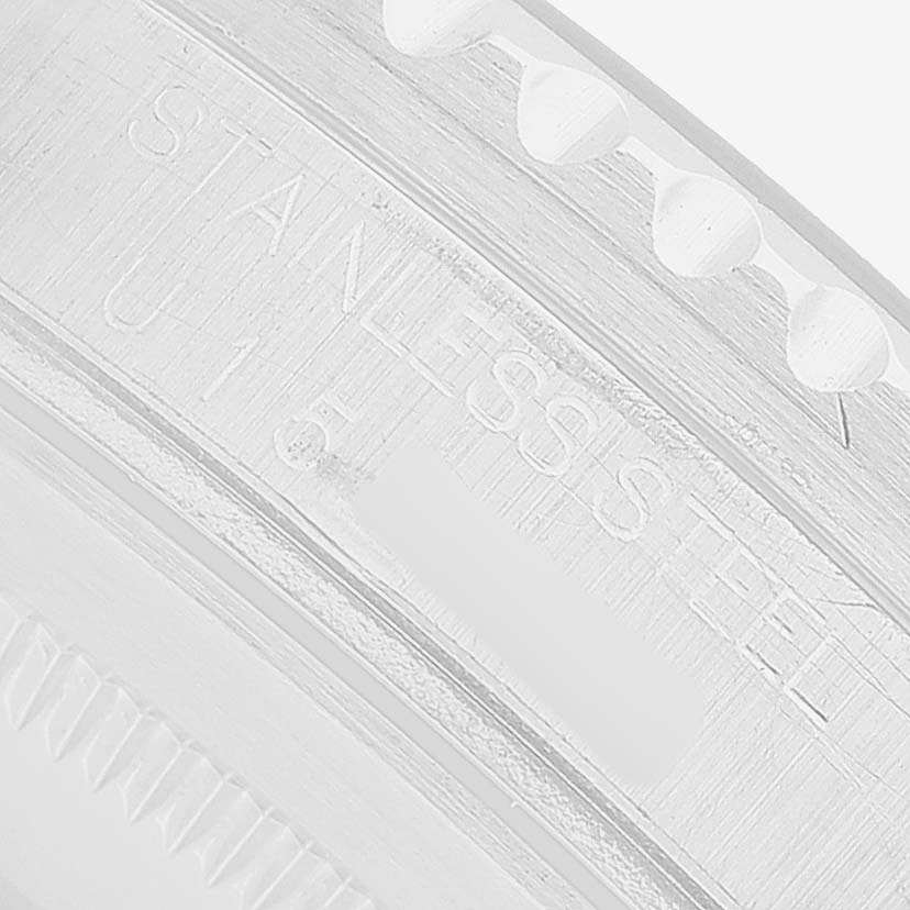 The image shows a close-up of the engraved "STAINLESS STEEL" detail on the case back of a Rolex GMT-Master 16700 Men's Stainless Steel Black Dial.