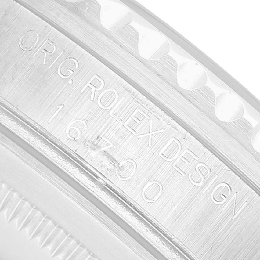 The image shows a close-up of the inner bezel with the model number engraved on the Rolex GMT-Master 16700 Men's Stainless Steel Black Dial watch.