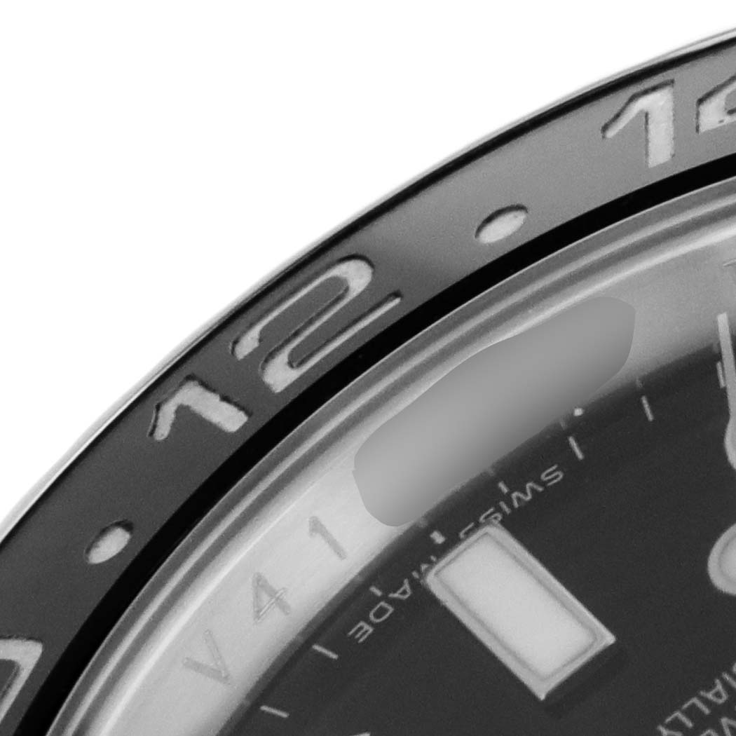 The image shows a close-up angle of the bezel and partial dial of a Rolex GMT-Master 116710 Men's Stainless Steel Black Dial 116710 Men's Stainless Steel Black Dial watch.