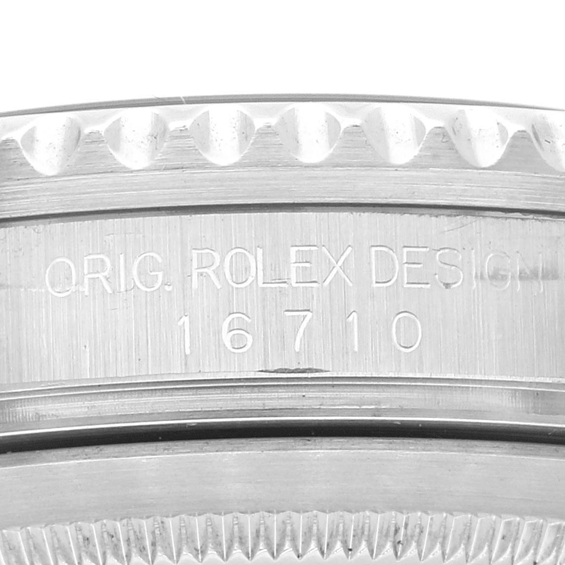 The image shows a close-up of the case side of a Rolex GMT-Master 16710 Men's Stainless Steel Black Dial 16710 Men's Stainless Steel Black Dial, model number 16710, featuring the engraved serial and model information.