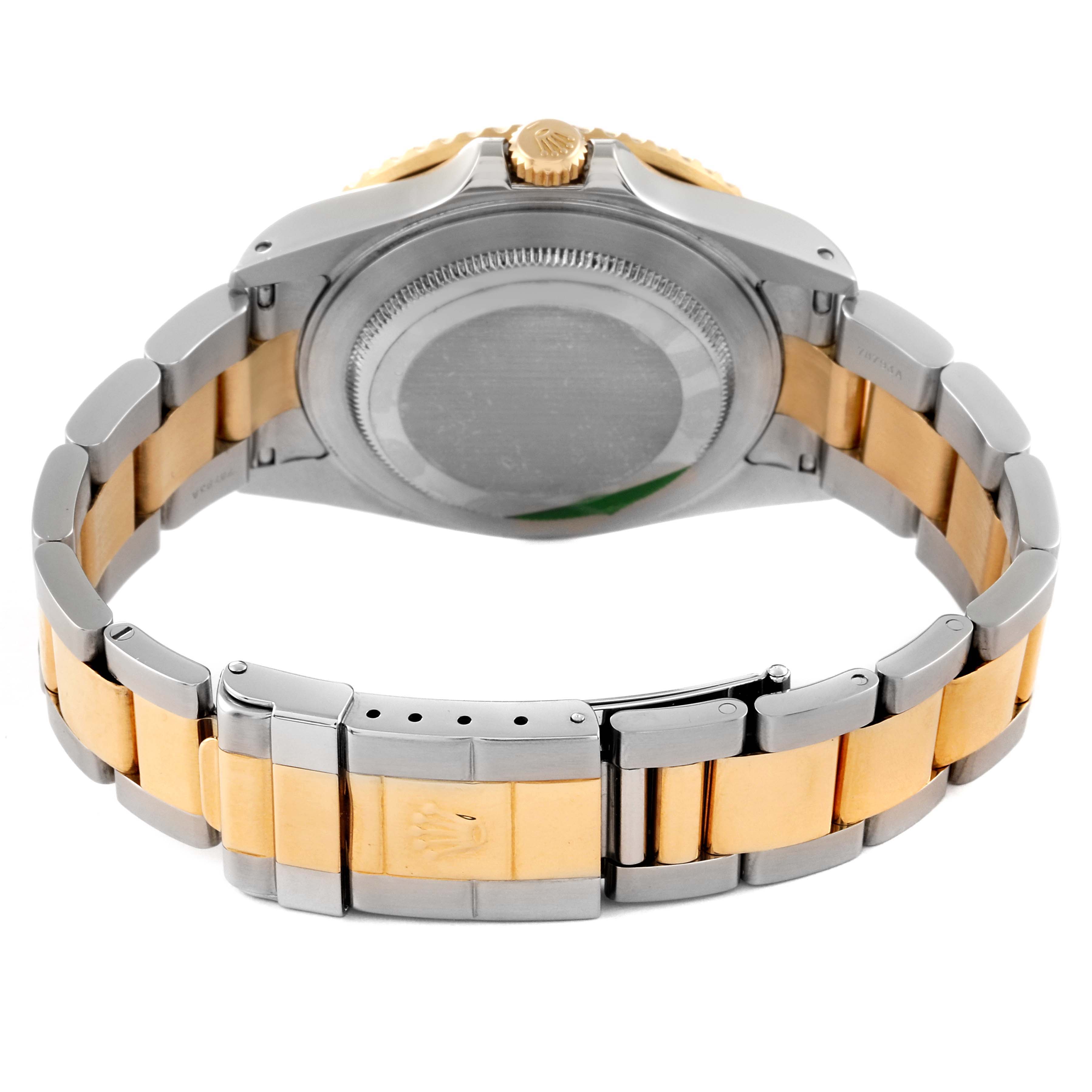 The image shows the back view of a Rolex GMT-Master 16713 Men's Steel and Gold (two tone) Brown Dial 16713 Men's Steel and Gold (two tone) Brown Dial watch, highlighting its two-tone bracelet and case back.