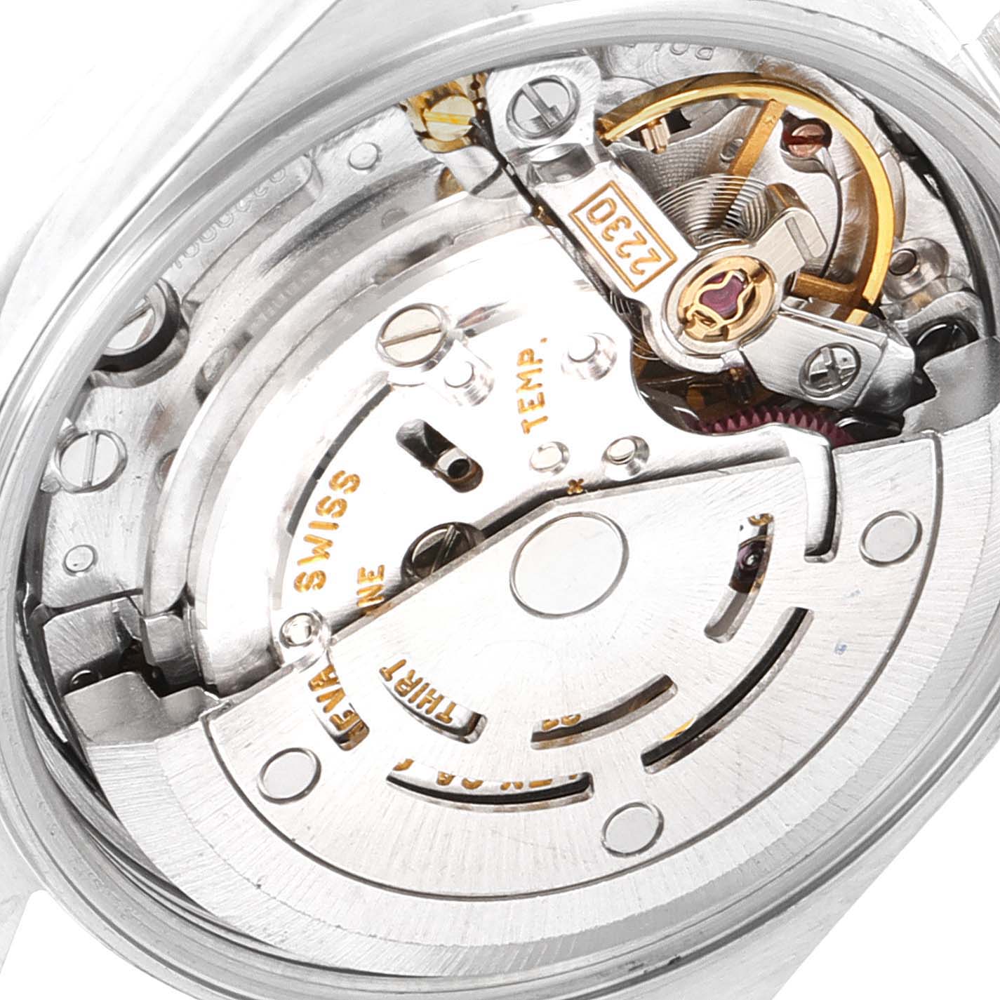 This image shows a close-up of the movement and internal mechanism of a Rolex Oyster Perpetual 76080 Women
s Stainless Steel Pink Dial 76080 Women
s Stainless Steel Pink Dial watch from an angled perspective.