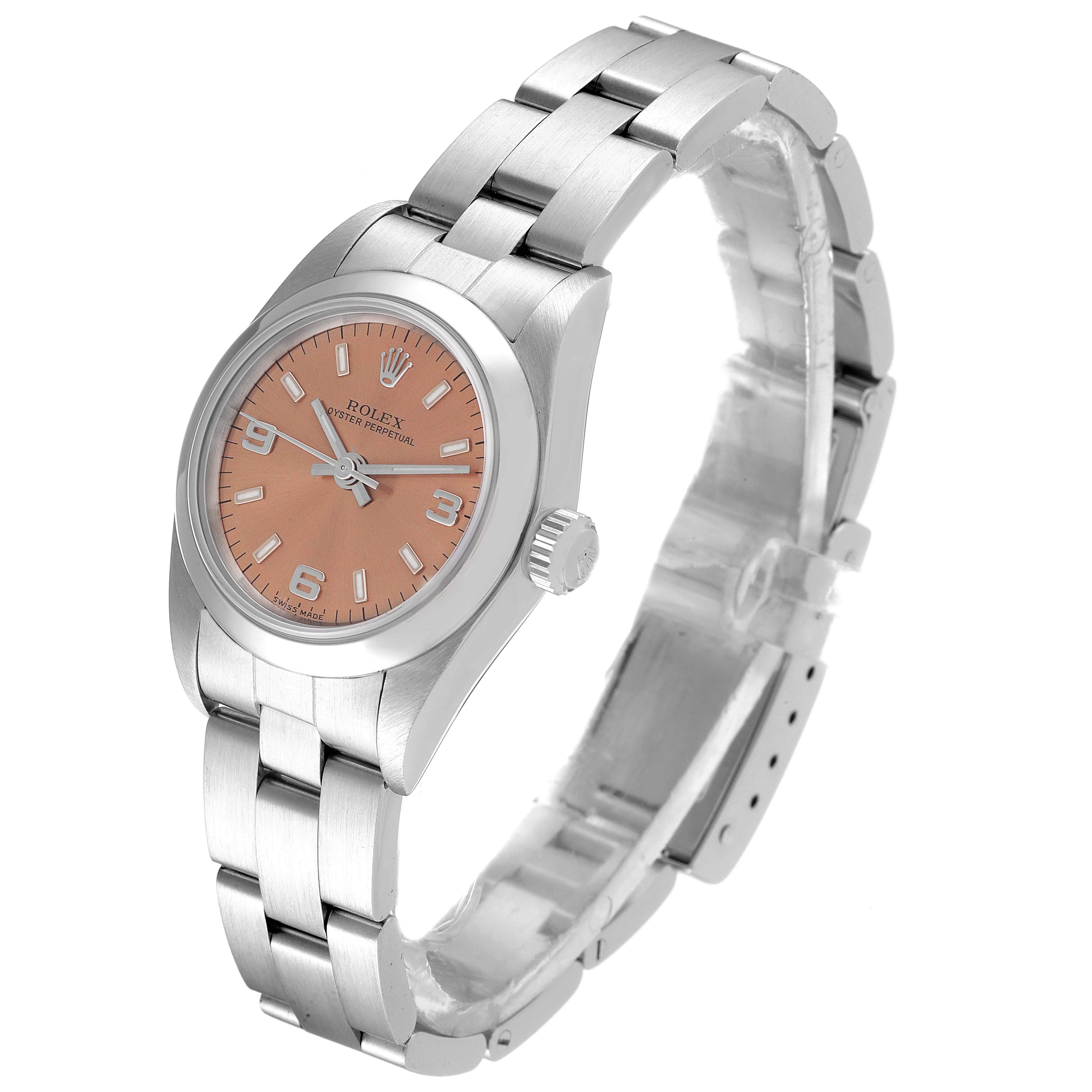 This image shows a Rolex Oyster Perpetual 76080 Women
s Stainless Steel Pink Dial 76080 Women
s Stainless Steel Pink Dial watch at an angle that highlights the face, crown, and bracelet.