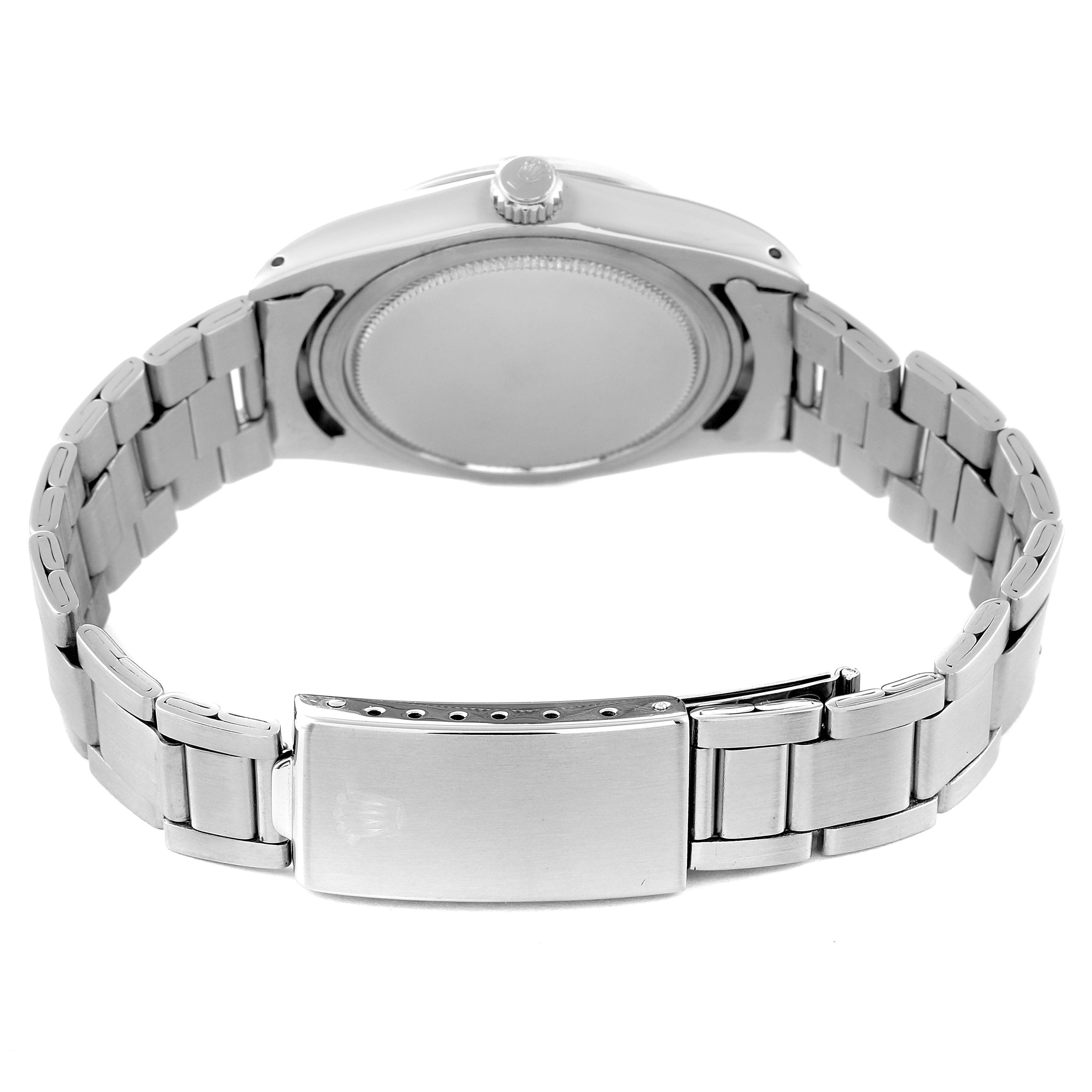 The image shows the back view of the case, crown, and bracelet of a Vintage Collection Rolex watch.